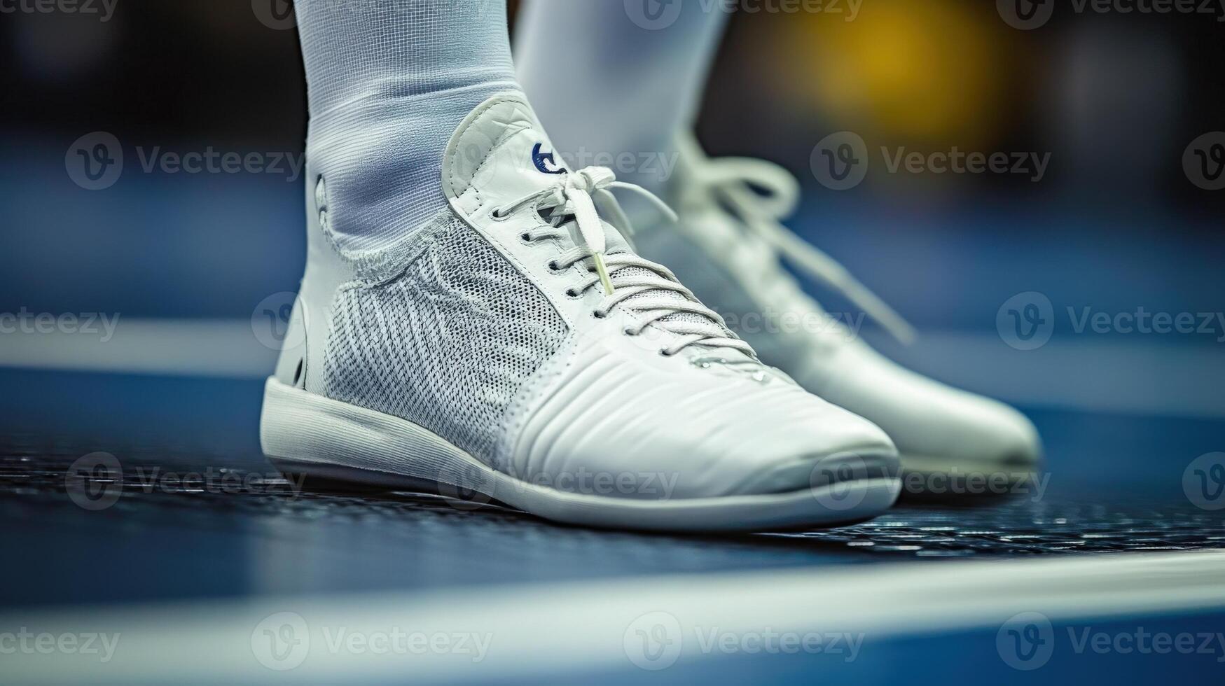 Close-up view of a pair of athletic shoes on a court surface. photo