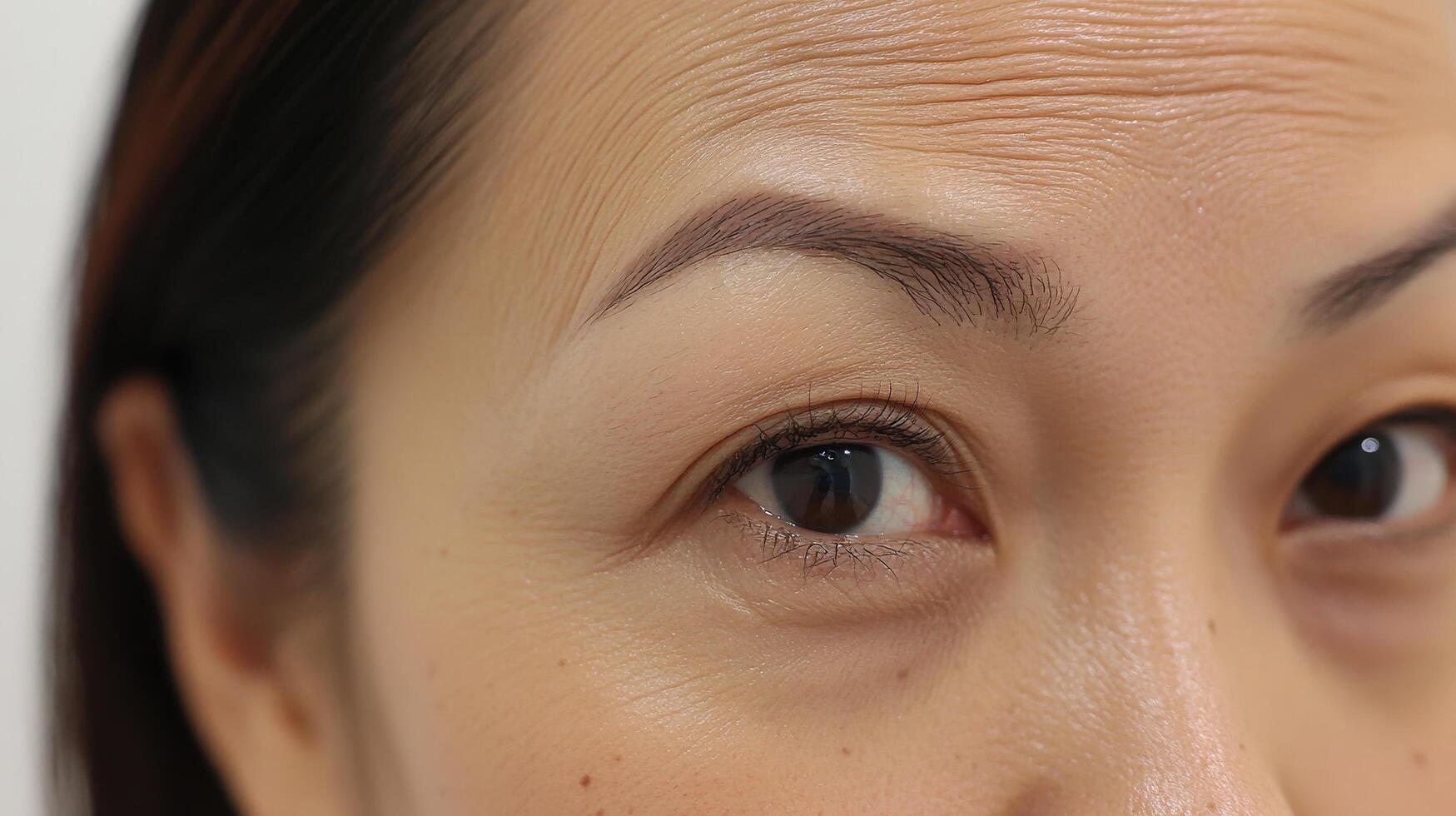 Close-up facial view of a person's aged features. photo