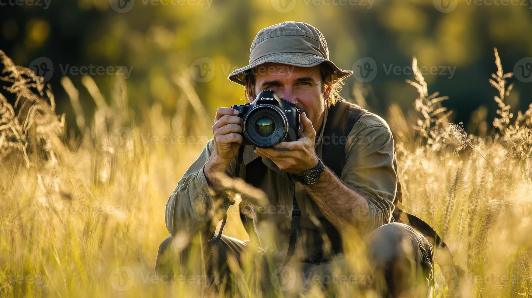 A nature photographer taking photos in a tall grass field.