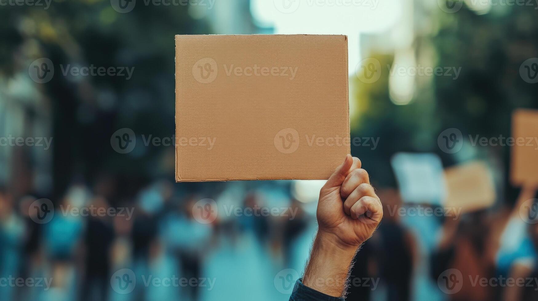 Blank protest sign held high in a crowd. photo