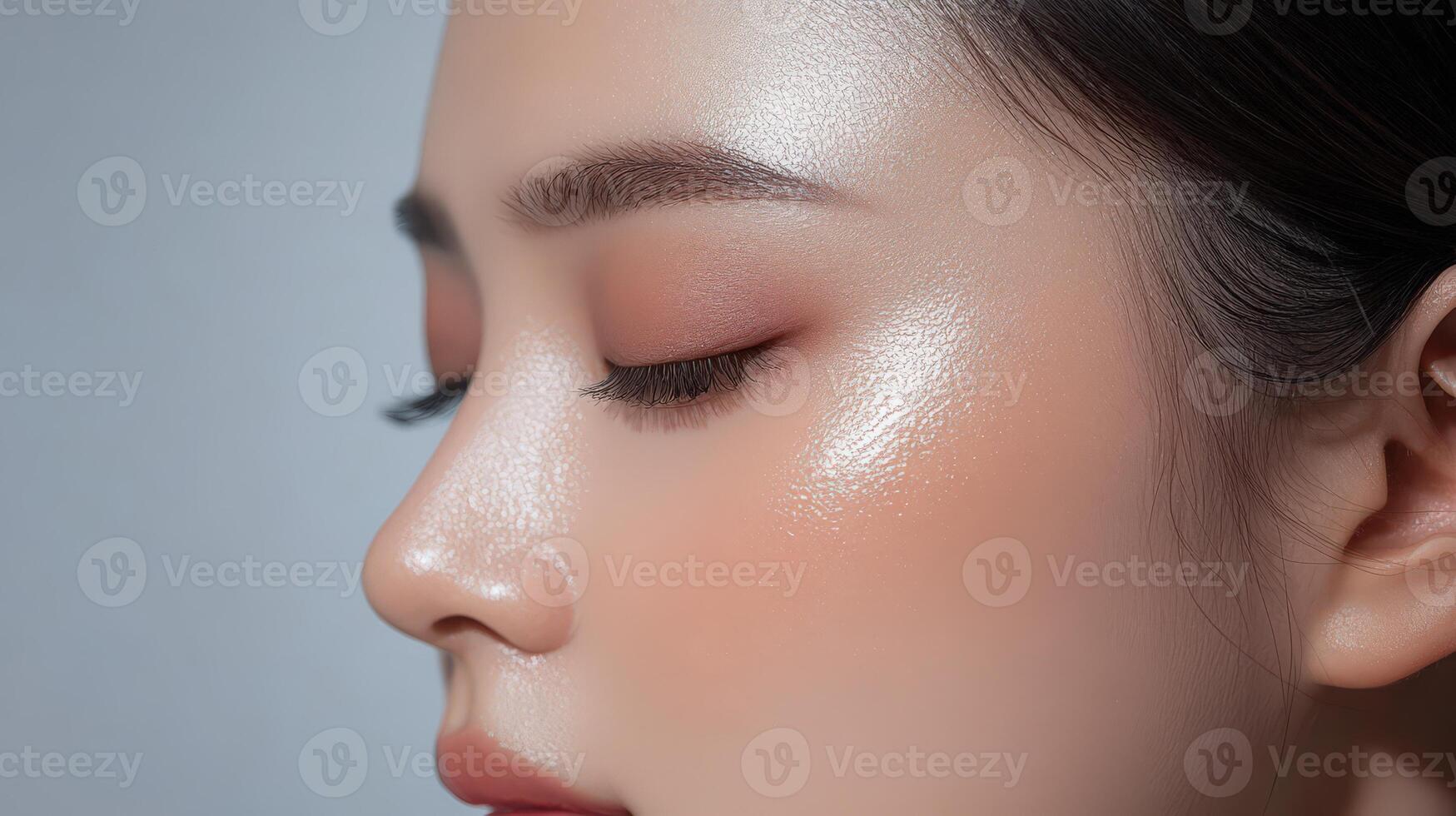 Close-up profile view of a person's face with subtle makeup photo