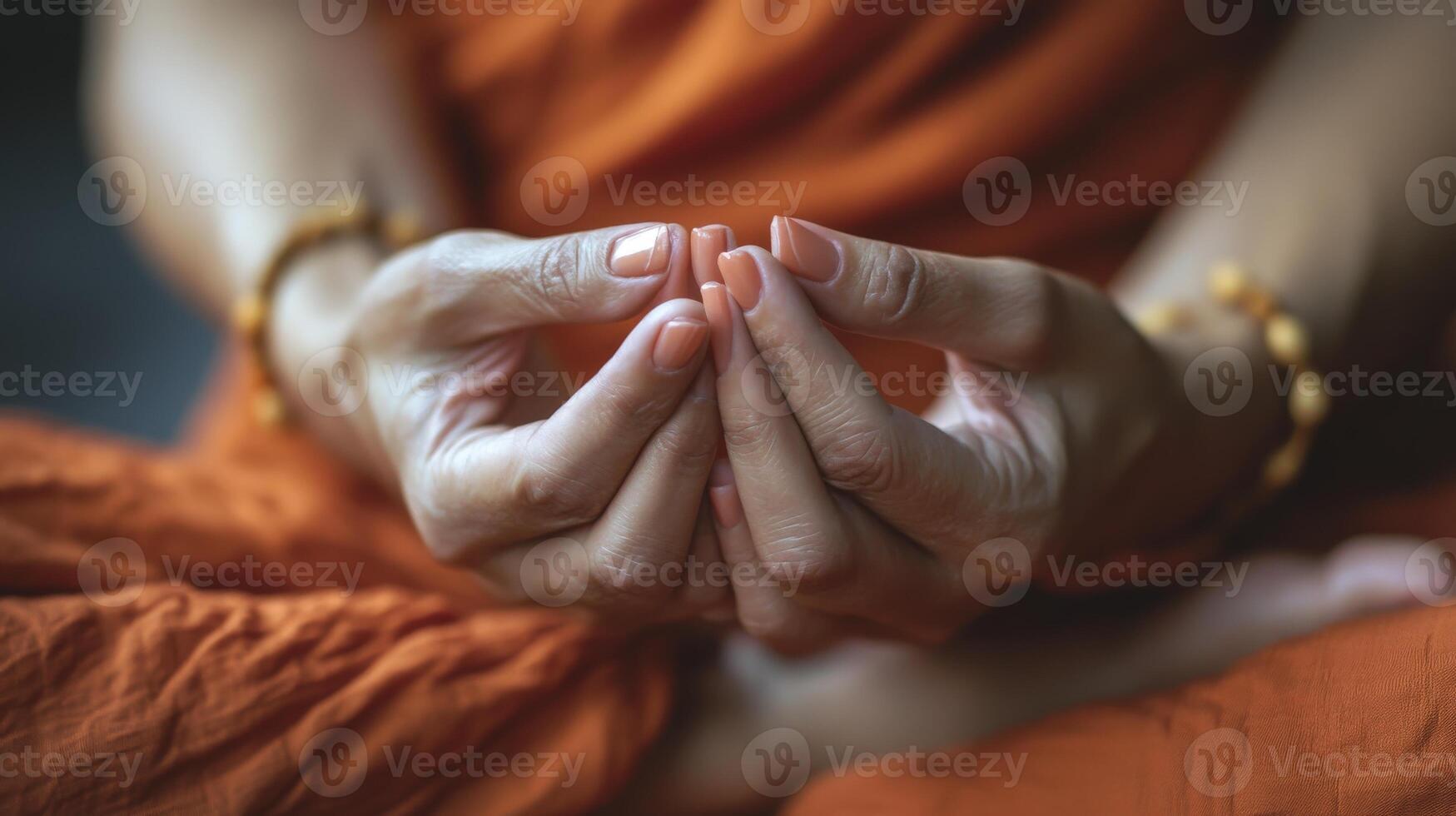 Close-up view of hands in a serene meditative pose. photo