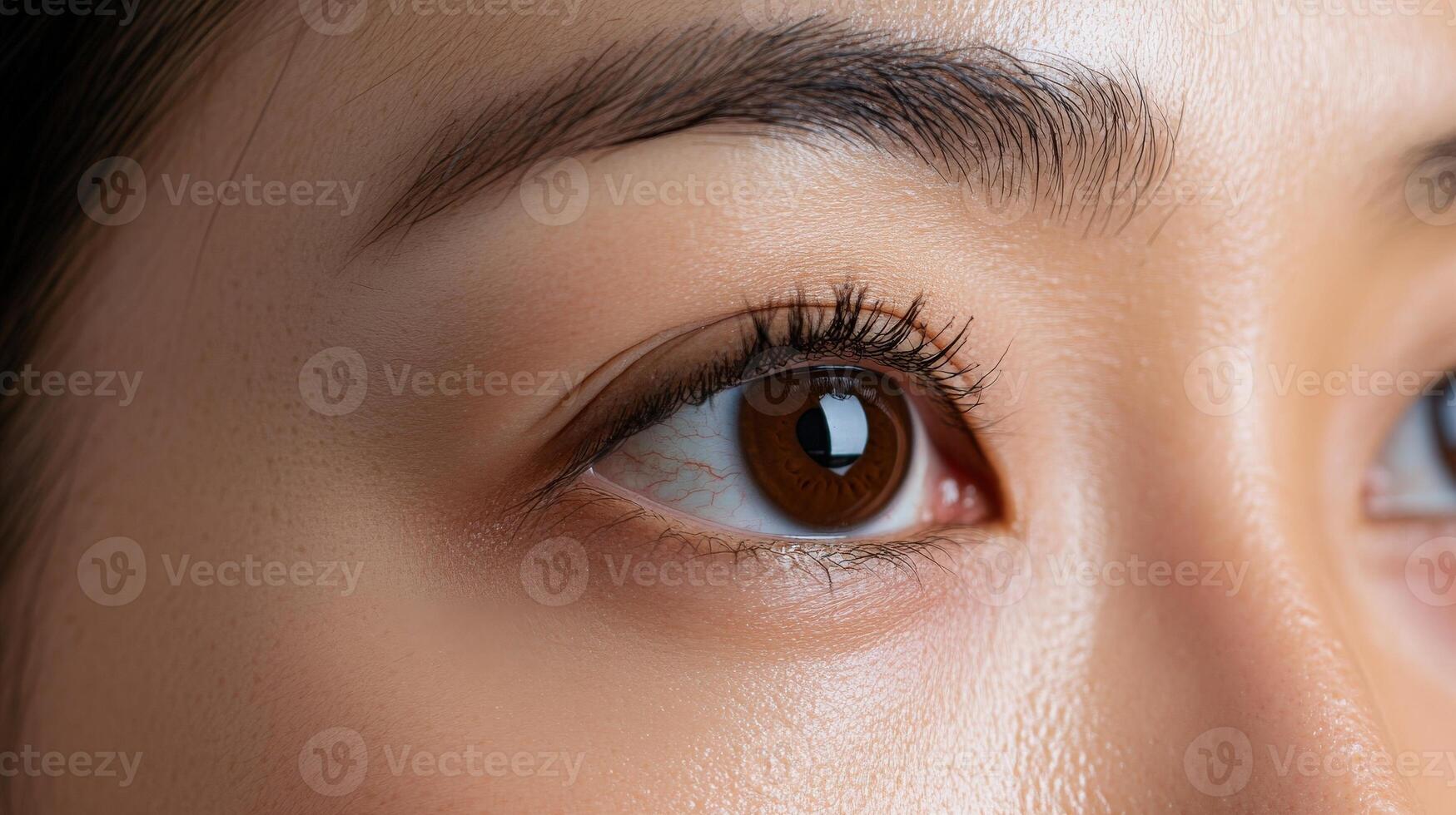 Close-up view of a woman's expressive eye. photo