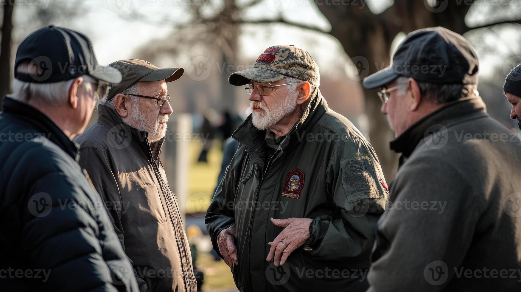 A group of older men in conversation outside in daytime photo