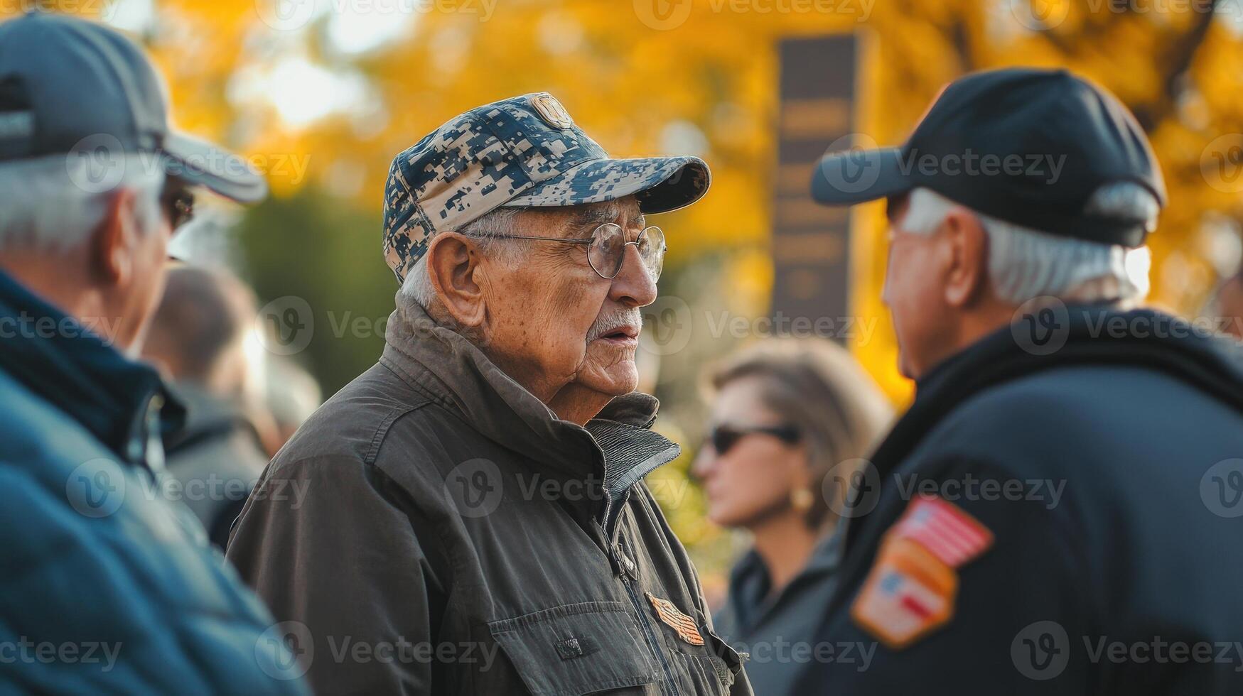Group of people talking outside during a sunny daytime event photo
