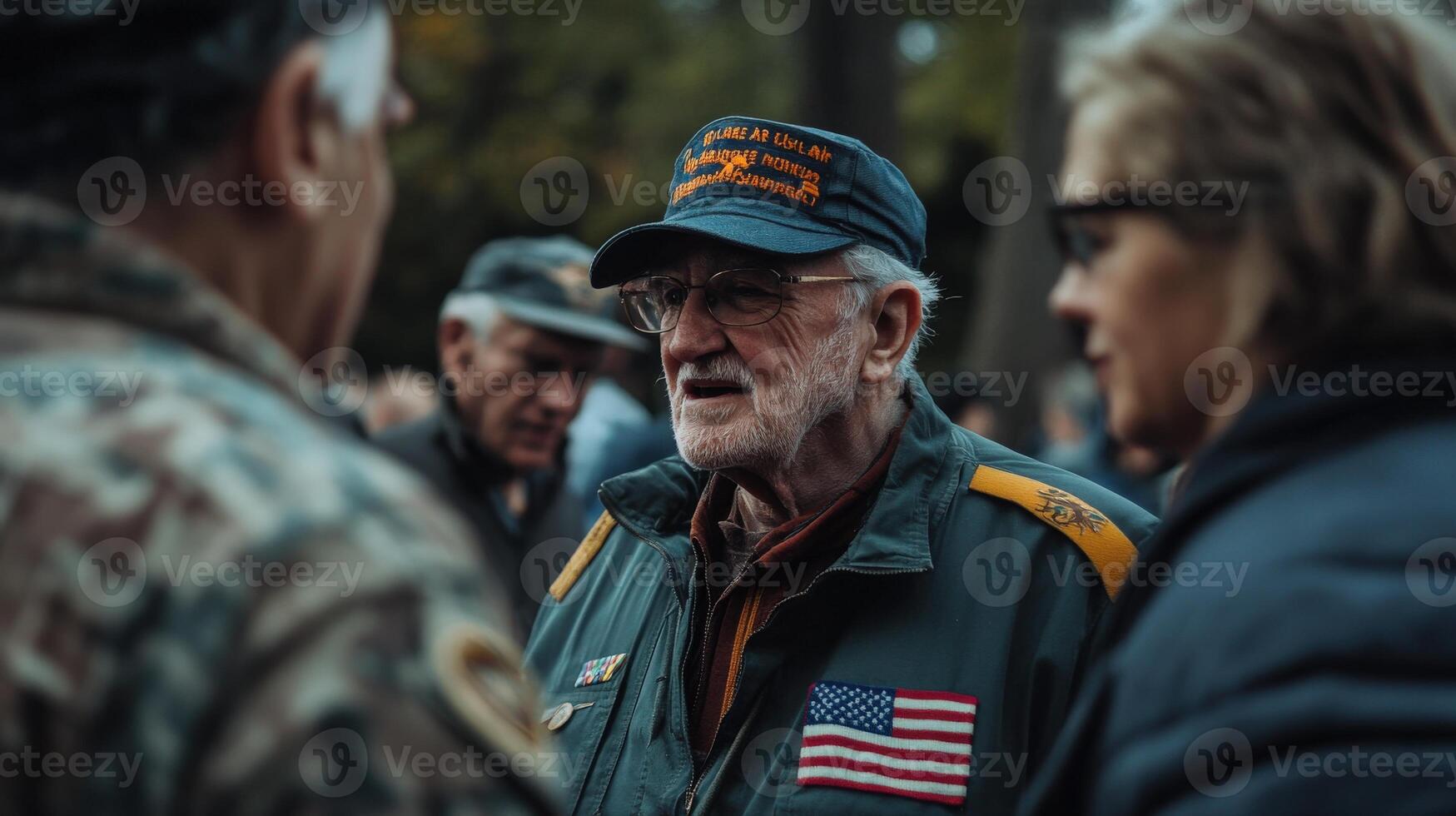 A veteran in conversation with people at an outdoor gathering photo