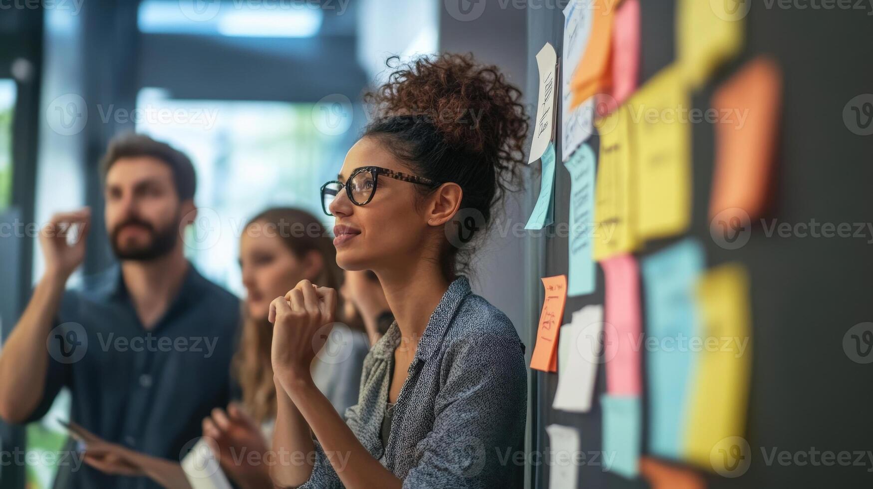 A group of professionals brainstorming in an office setting photo