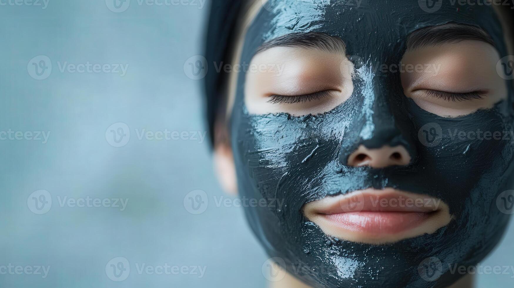 Close-up view of a person with a dark face mask. photo