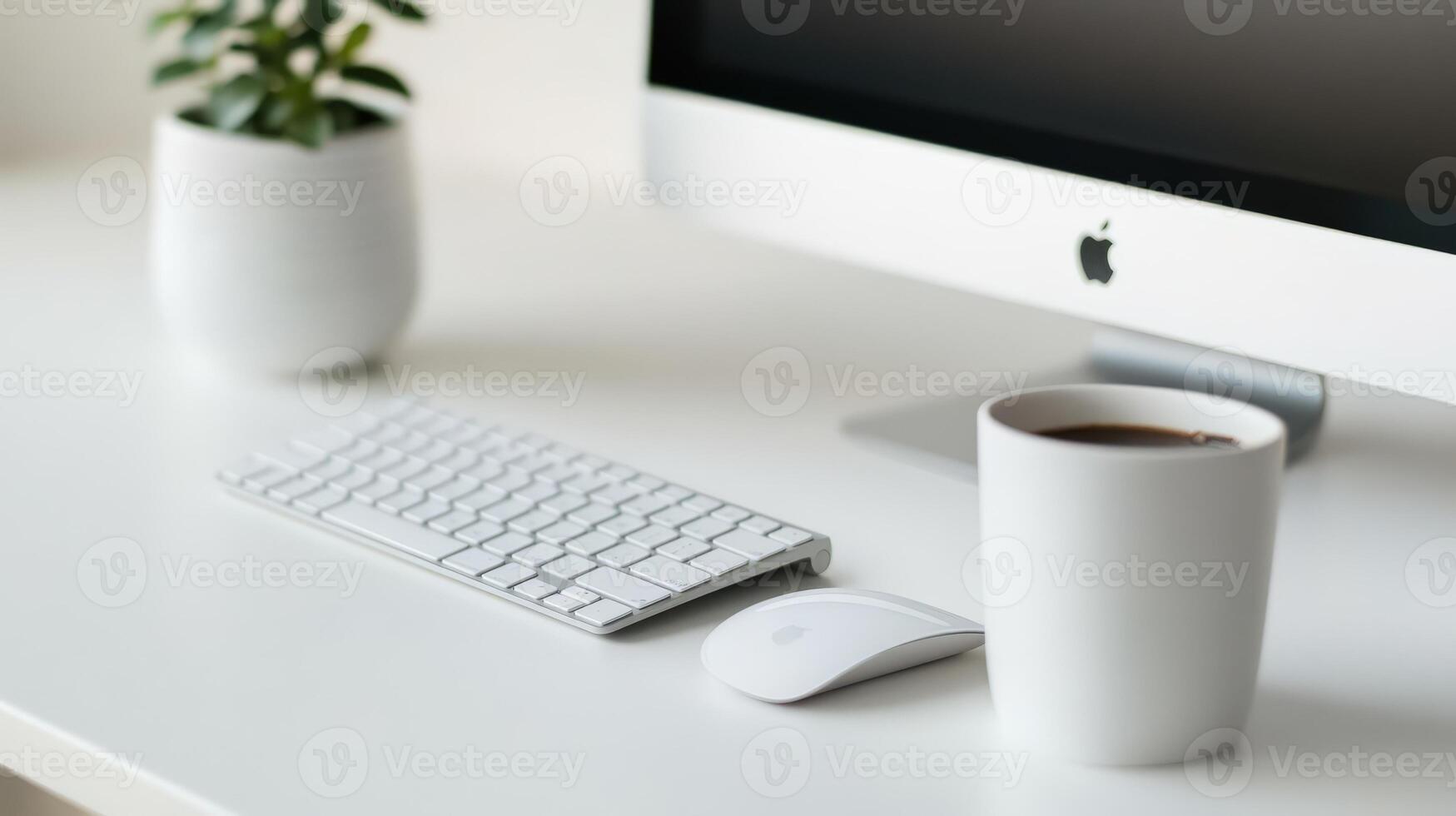 Modern workspace featuring a computer, keyboard, and coffee cup. photo