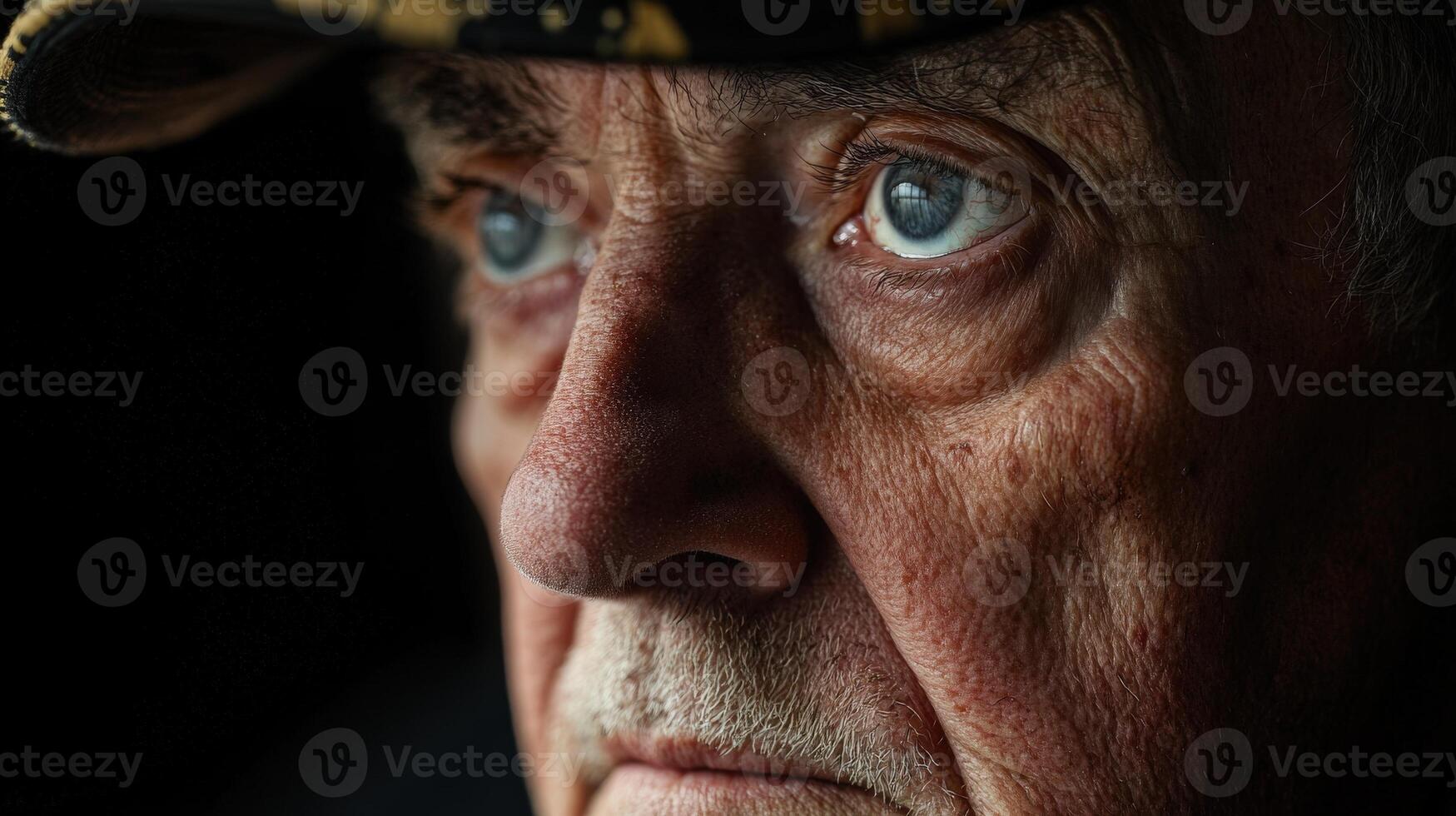 A close up portrait of an older man looking thoughtfully ahead photo