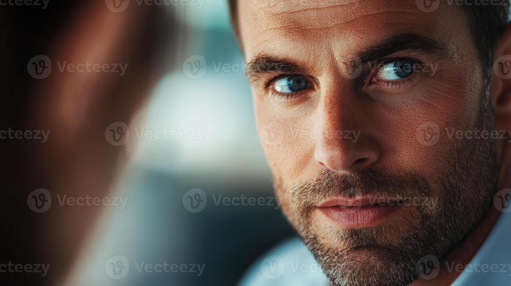 A close up portrait showing a man looking directly into the camera photo