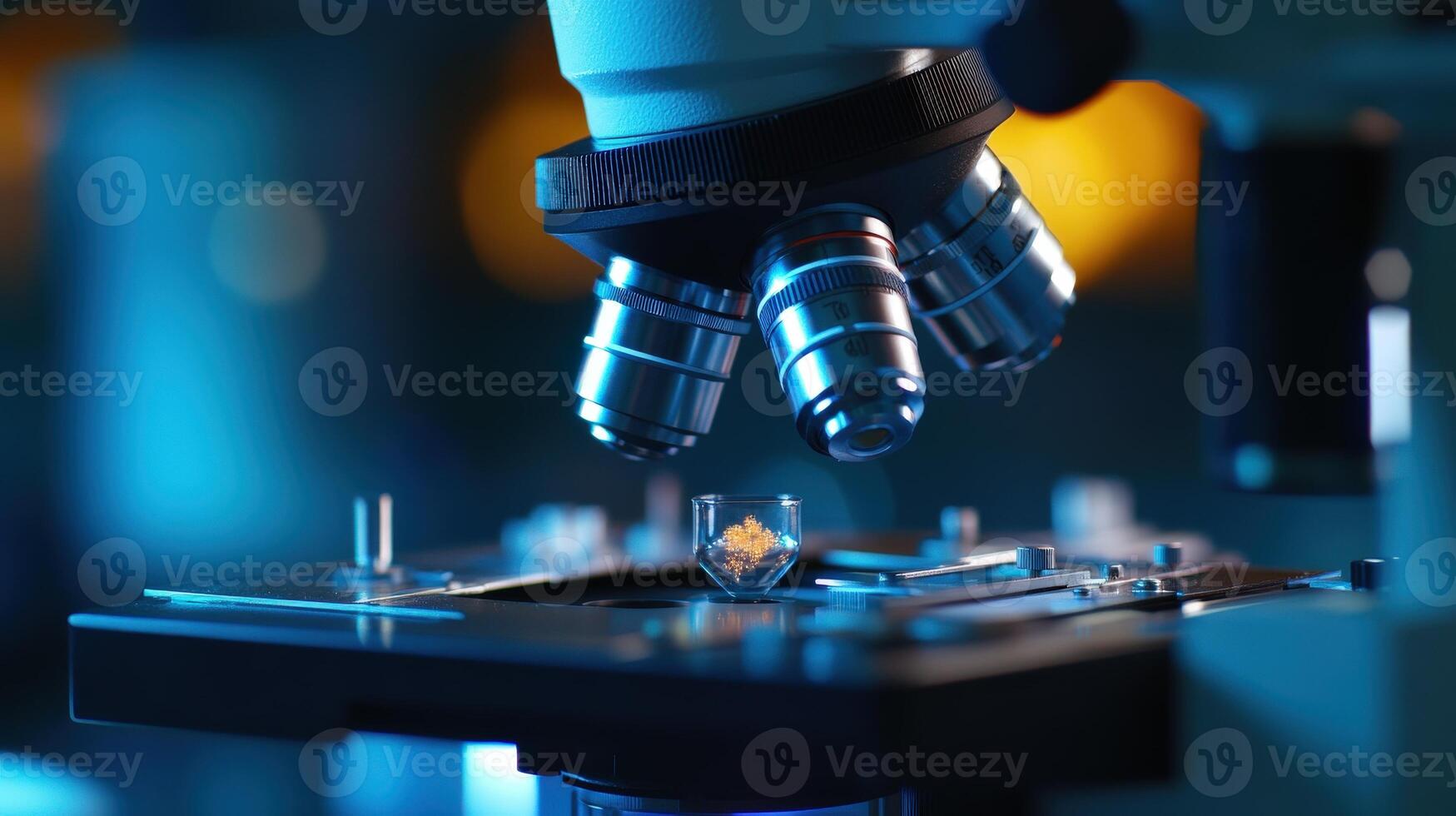 Close-up view of a laboratory microscope focusing on a small specimen. photo