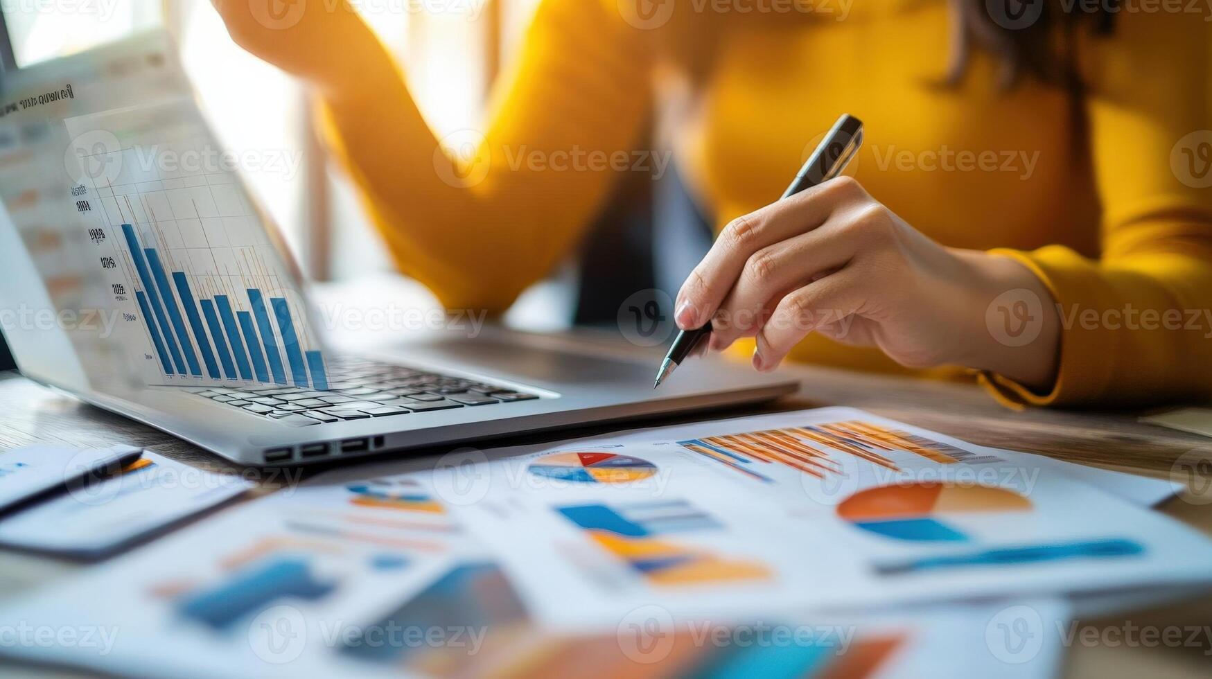 Close-up view of a person reviewing financial data. photo