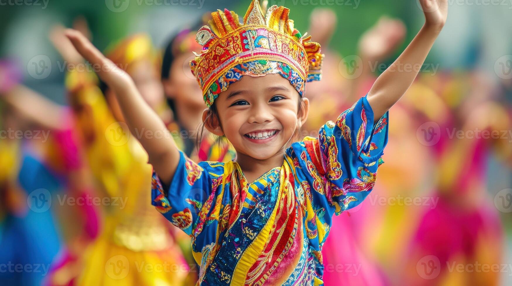 Joyful child in vibrant traditional costume during a celebration. photo