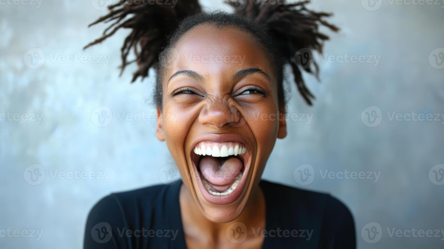 Ecstatic Woman Screaming Celebration Expressing Joy and Excitement with Dreadlocks Updo photo