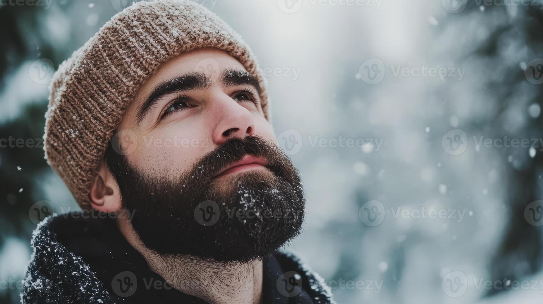 Bearded Man in Winter Hat Gazing Upward Towards Snow, Snowy Day Outdoors photo