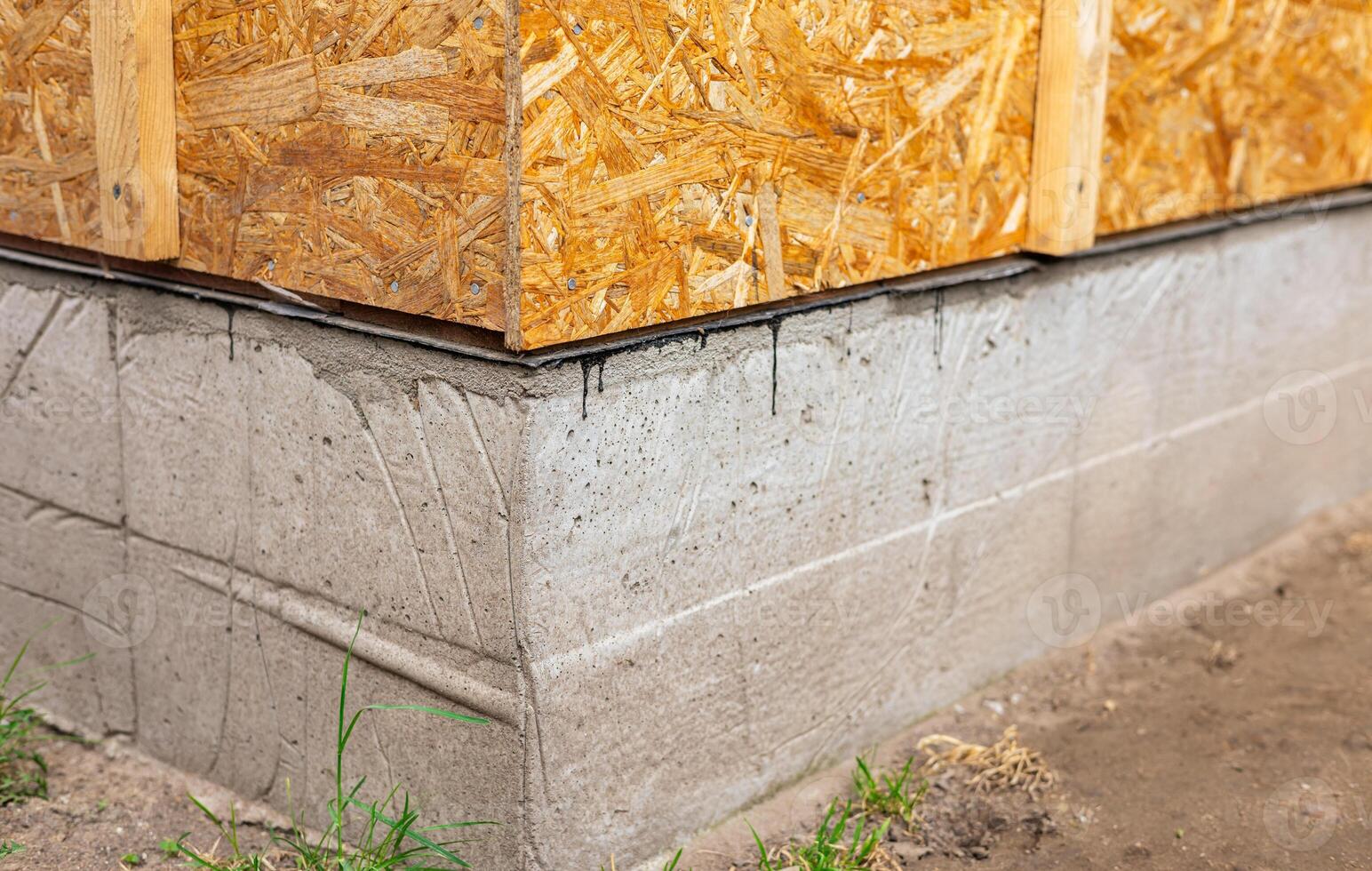Waterproofing of the house foundation Close-up of the house foundation with waterproofing. photo