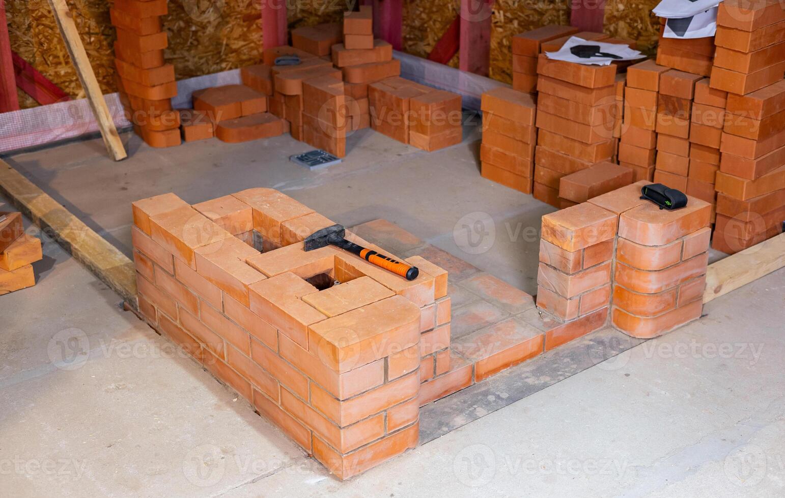 Construction of a stove to heat a wooden house. Assembly of the stove structure for heating photo
