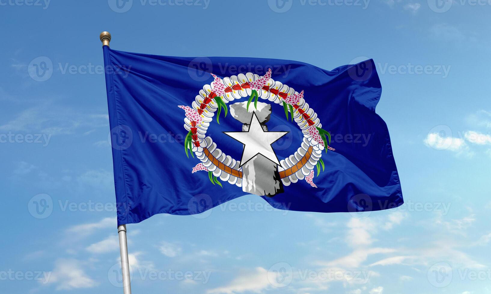 Flag of Northern Mariana Islands waving with latte stone and star emblem photo