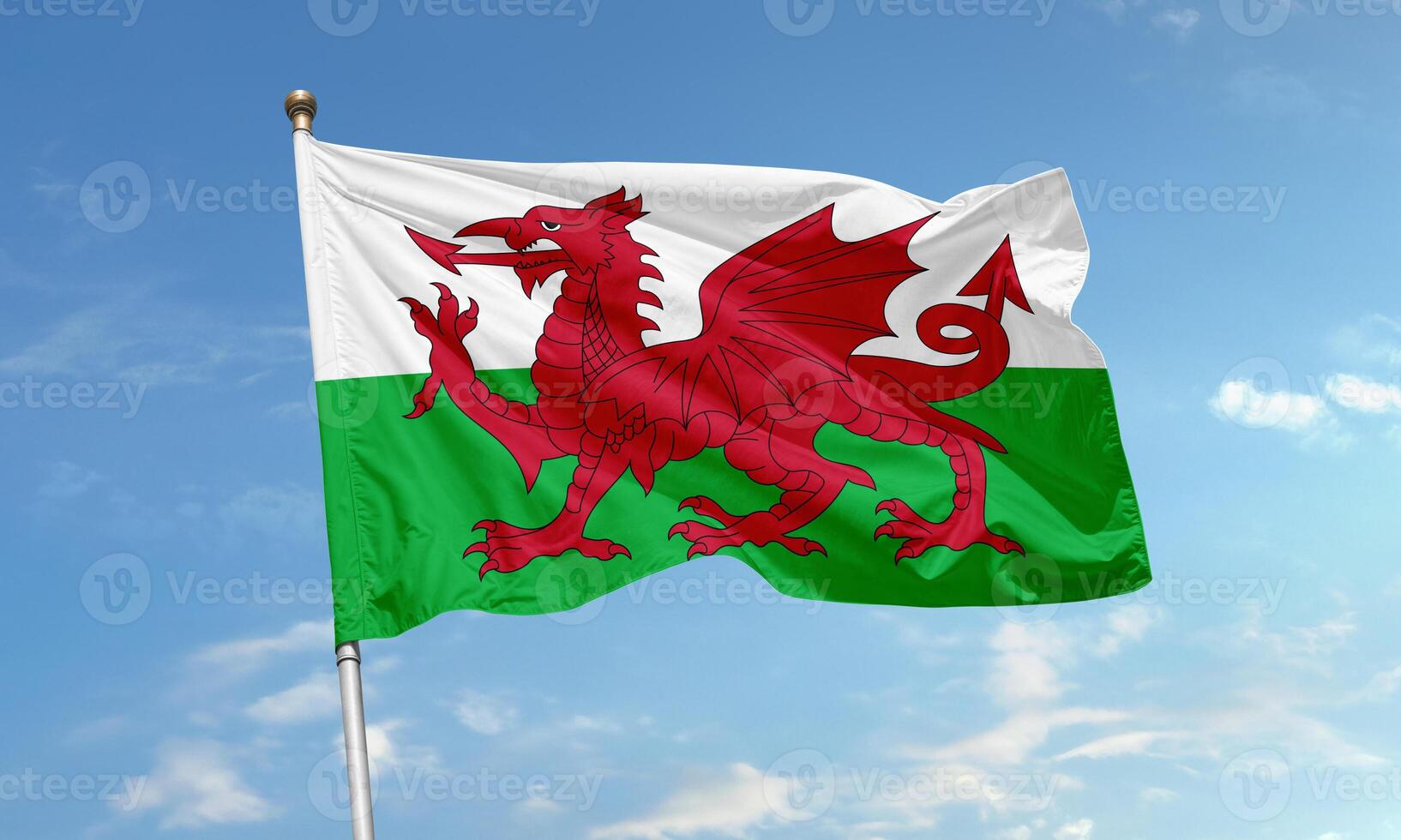 Welsh flag with red dragon flying in wind photo