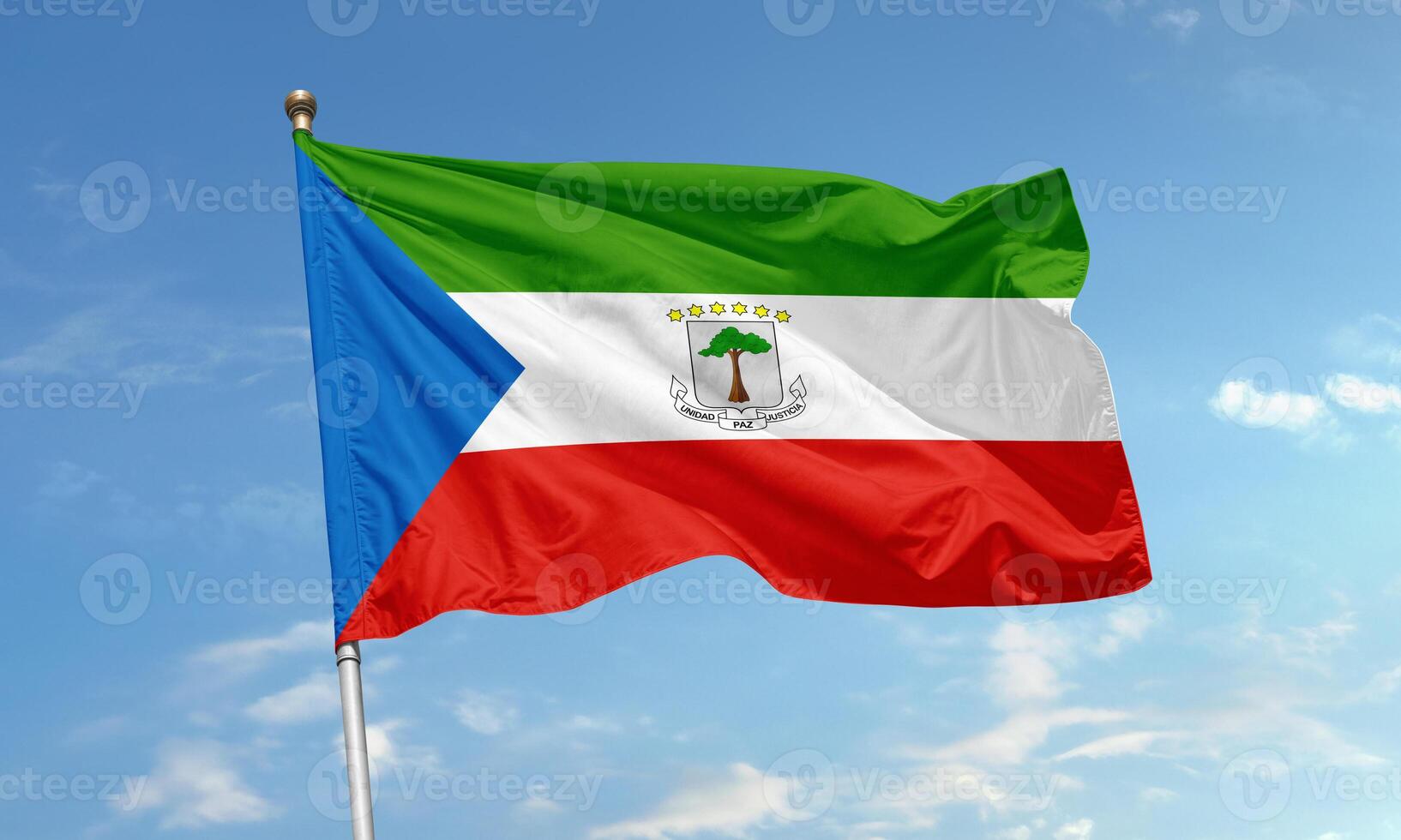 Equatorial Guinea national flag waving in sky photo