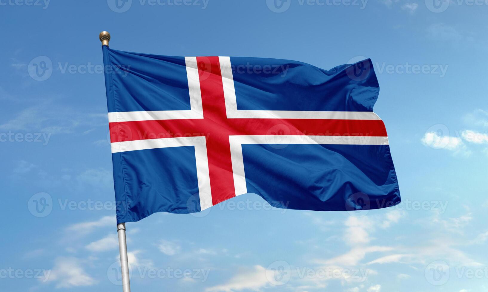 Iceland national flag waving in blue sky photo