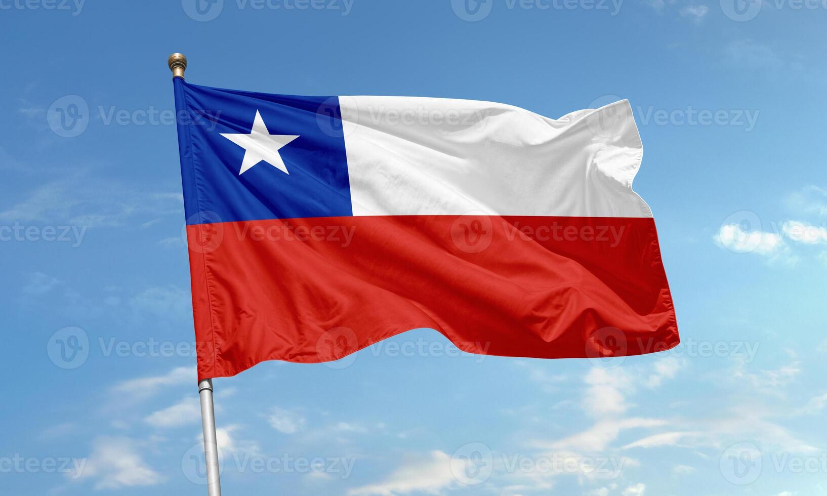 National flag of Chile waving in the wind with blue sky background photo