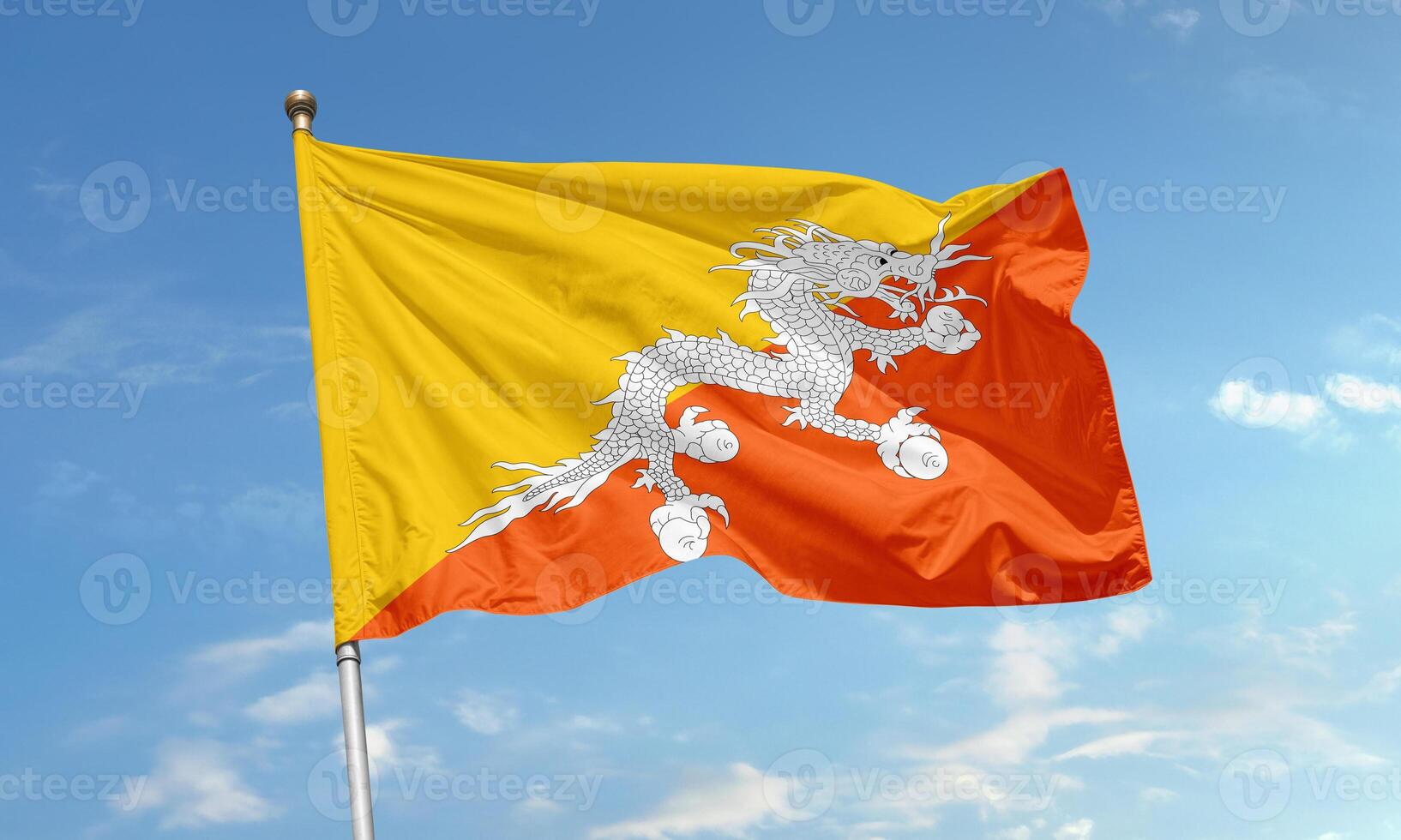 Bhutan national flag featuring white dragon symbolizing protection and purity over yellow and orange background photo