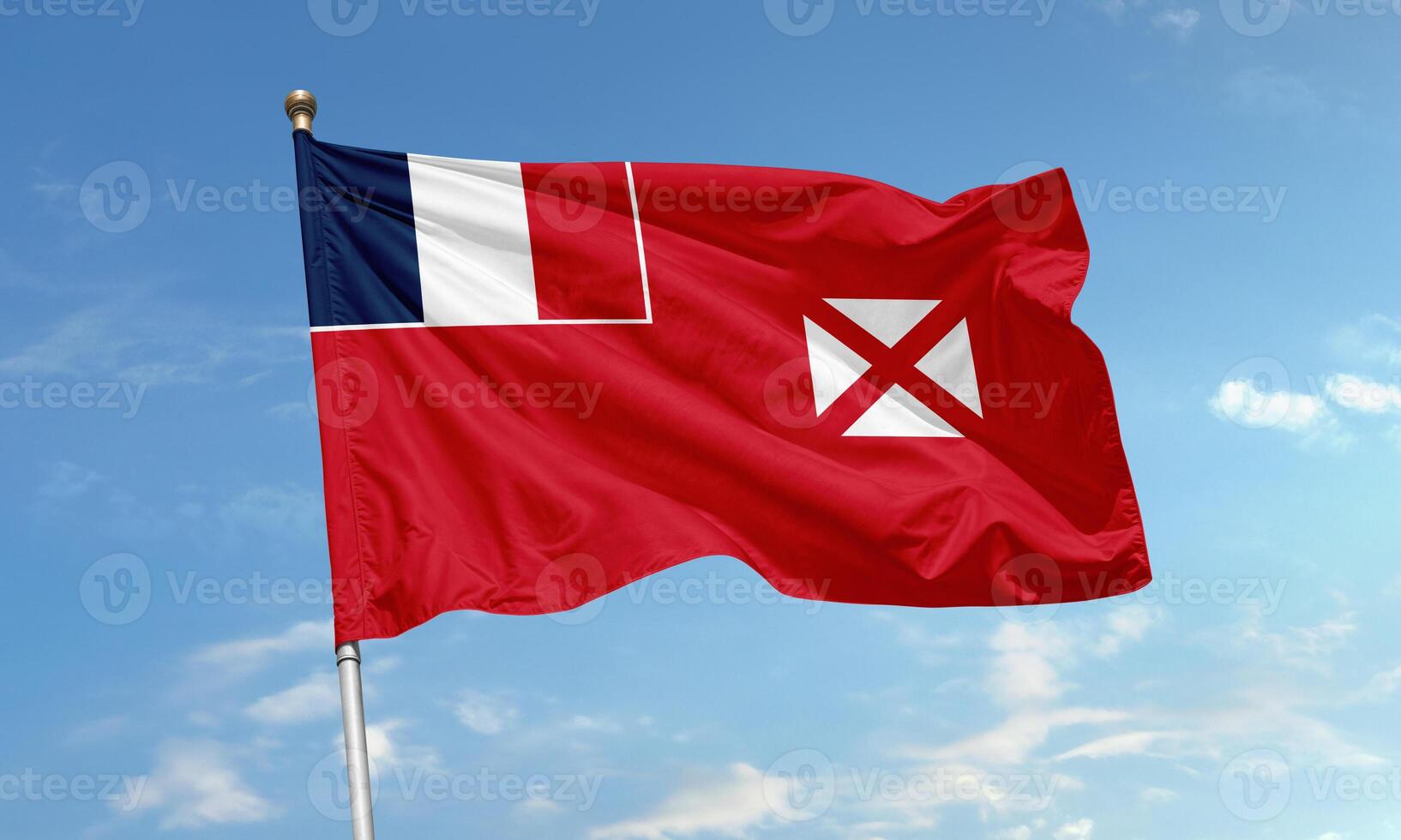Wallis and Futuna flag waving against sky photo