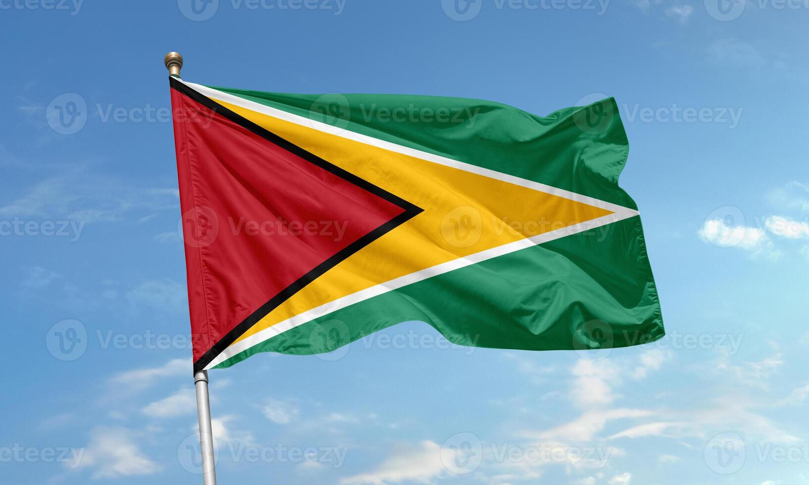 Flag of Guyana flying on flagpole photo
