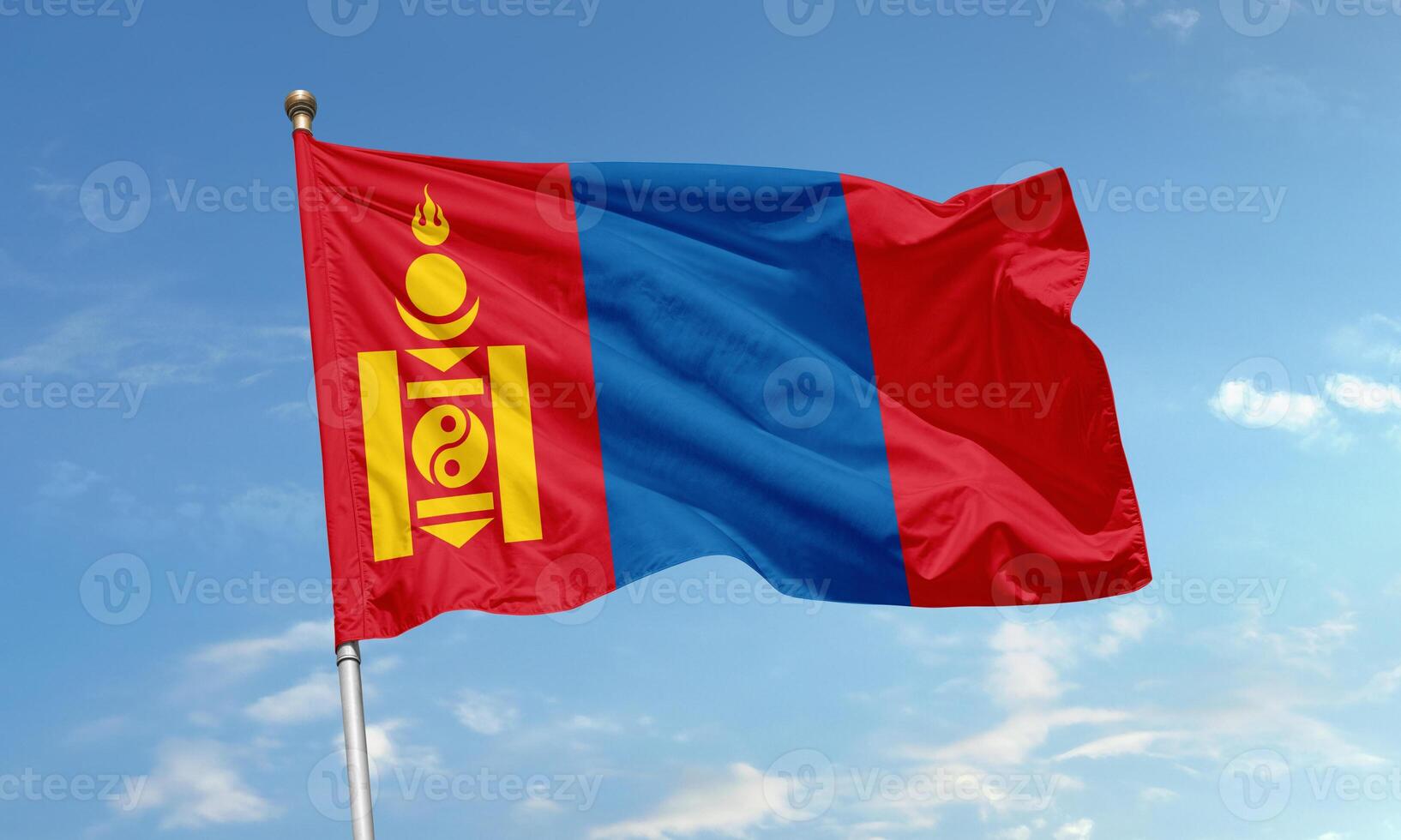 Mongolia national flag with Soyombo symbol waving in the clear blue sky photo