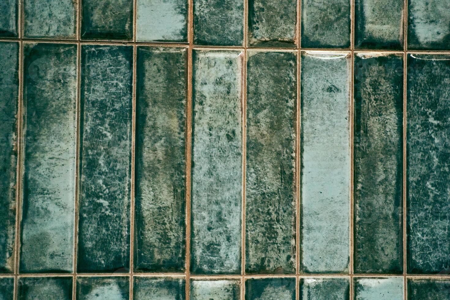 A pattern of modern vertical rectangular malachite tiles. Realistic texture. The walls are lined with green ceramic tiles with space for copying photo