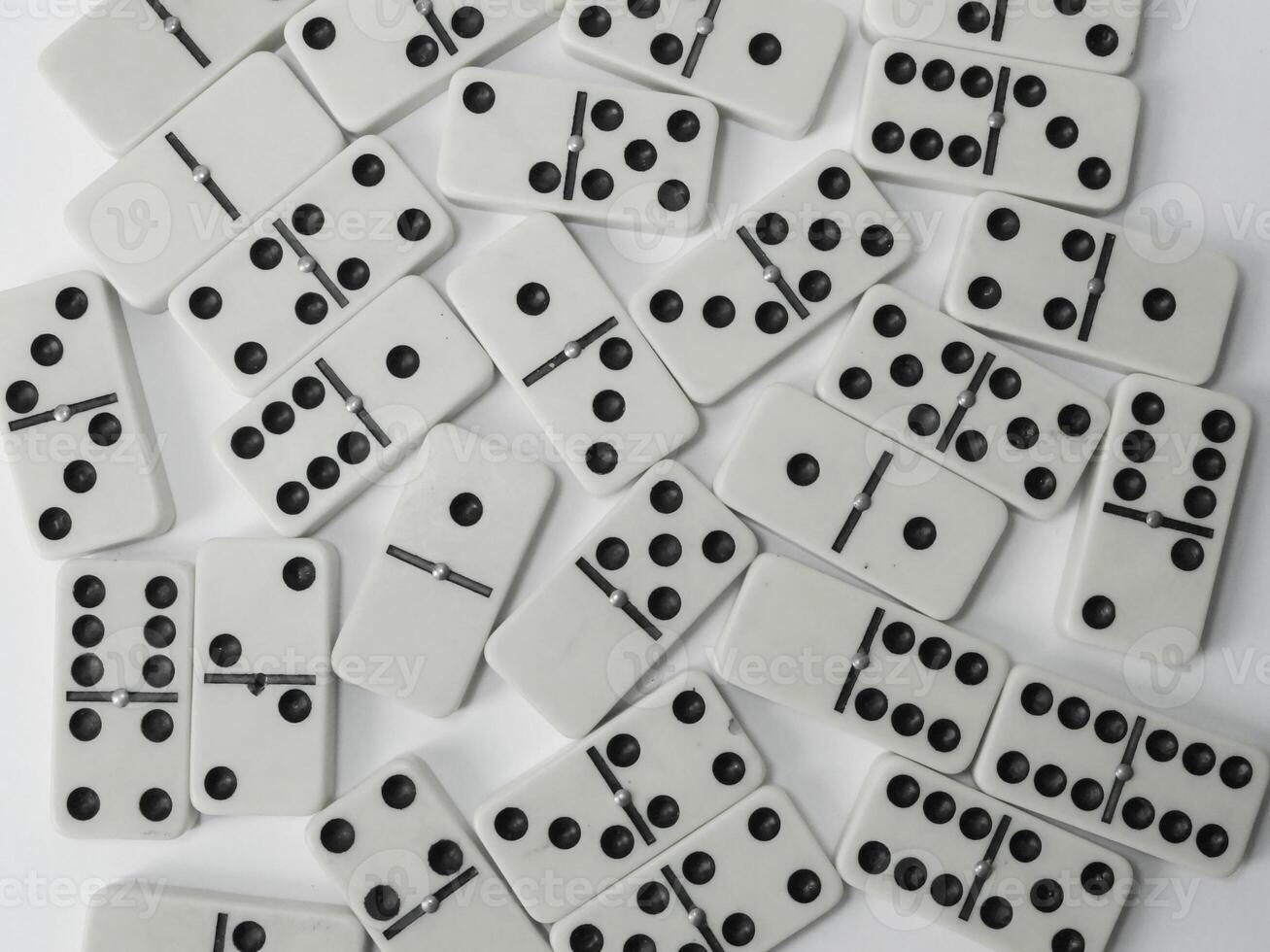 Dominoes figures on white background, playful arrangement, gaming concept photo