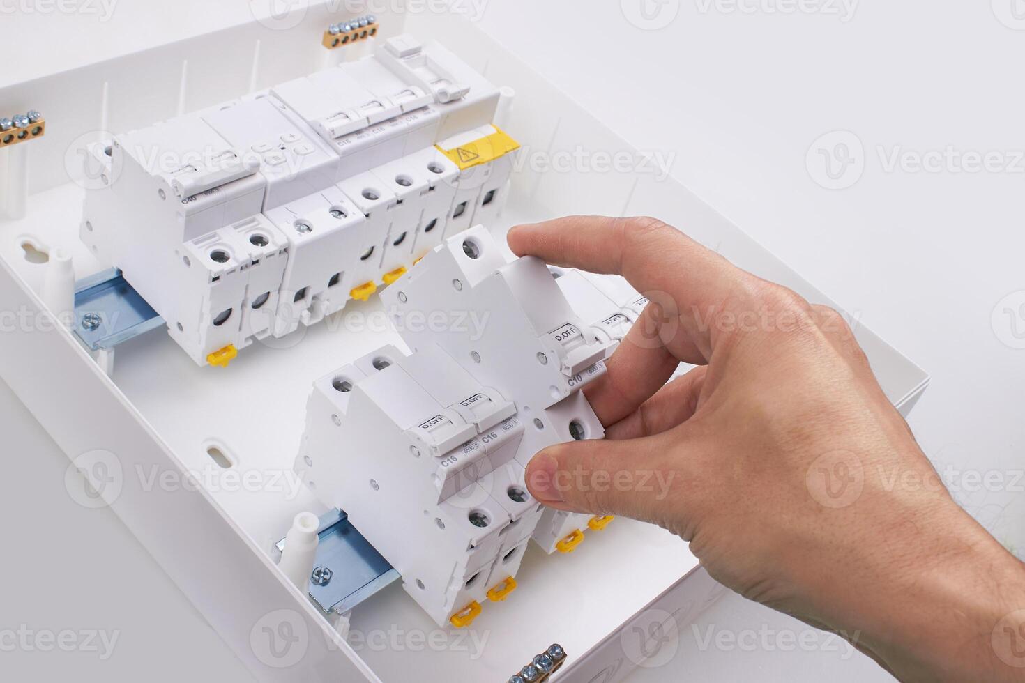 Automatic circuit breakers with hand, isolated on a white background photo
