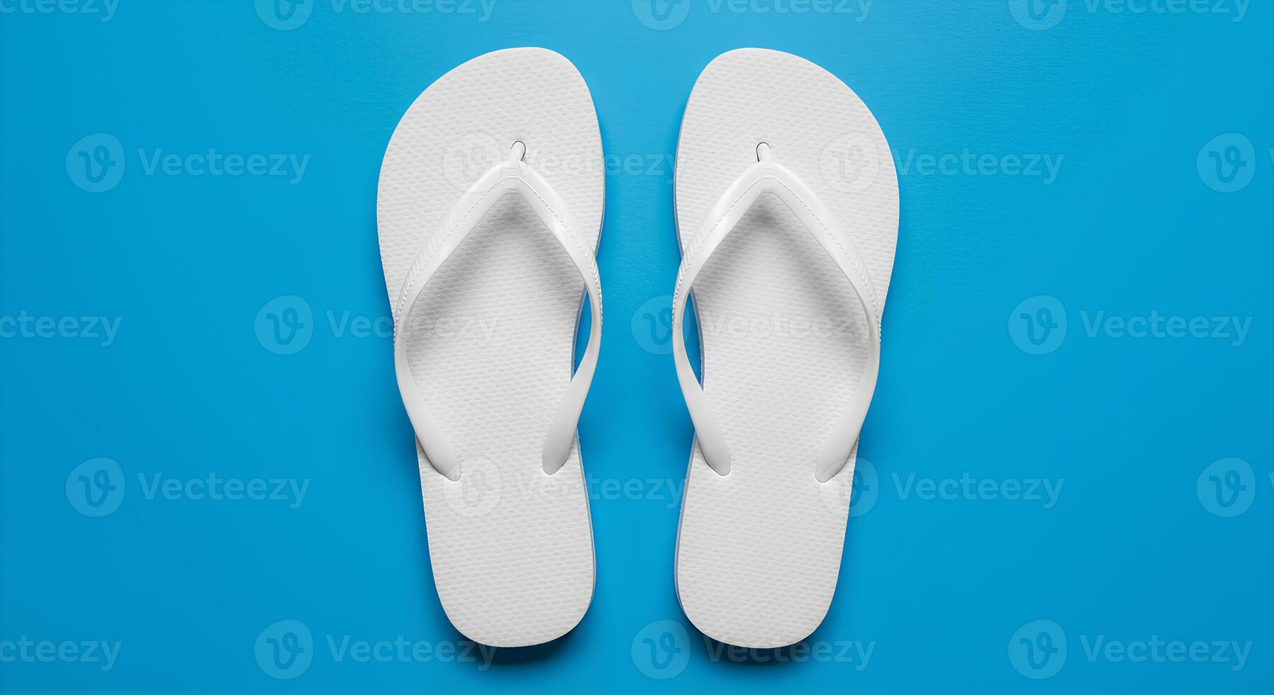 Top view flat lay of white flip flops on white background perfect for summer vacation visuals beach fashion ads and casual footwear design photo