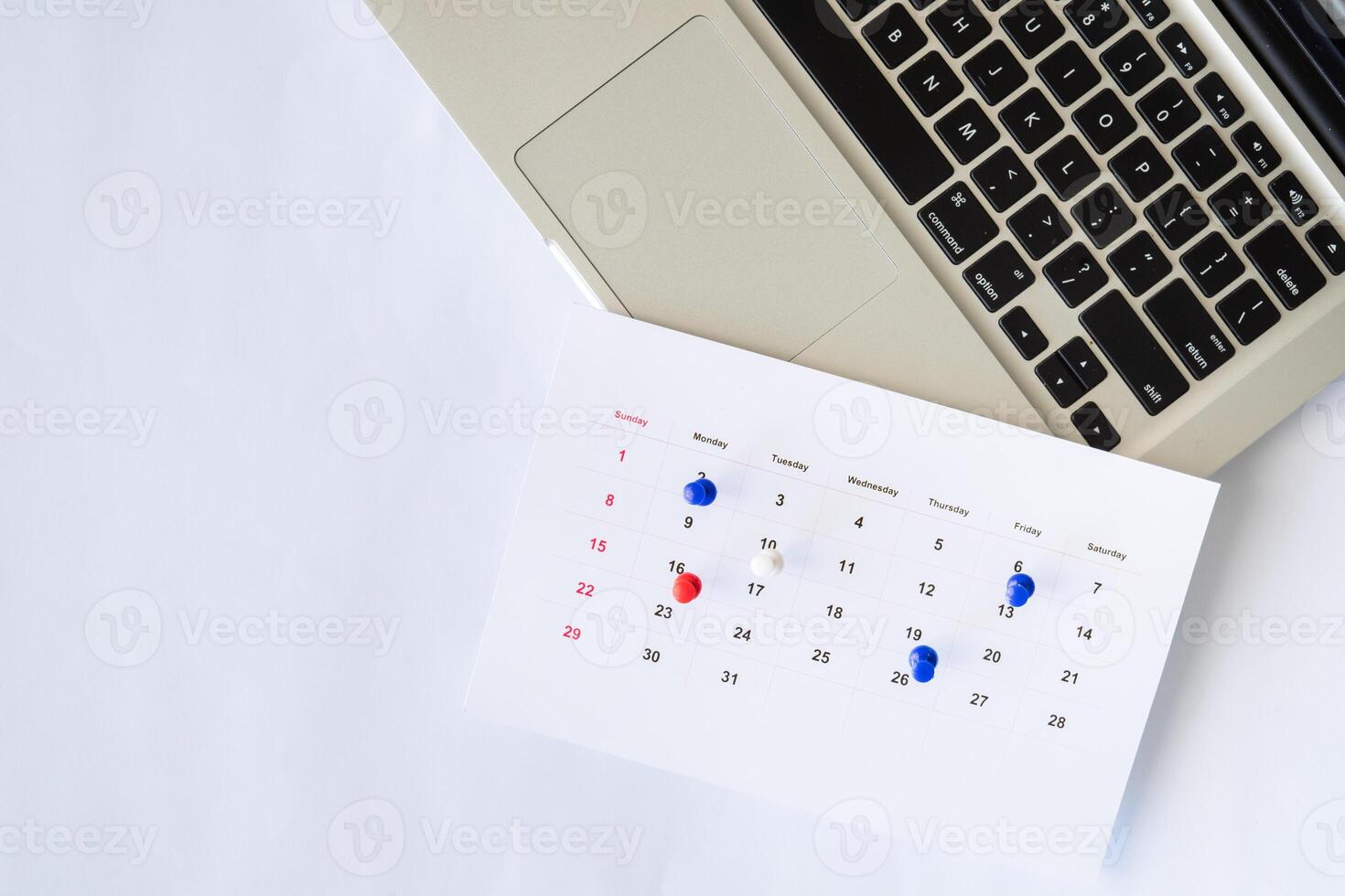 laptop with calendar and flat lay background copy space photo
