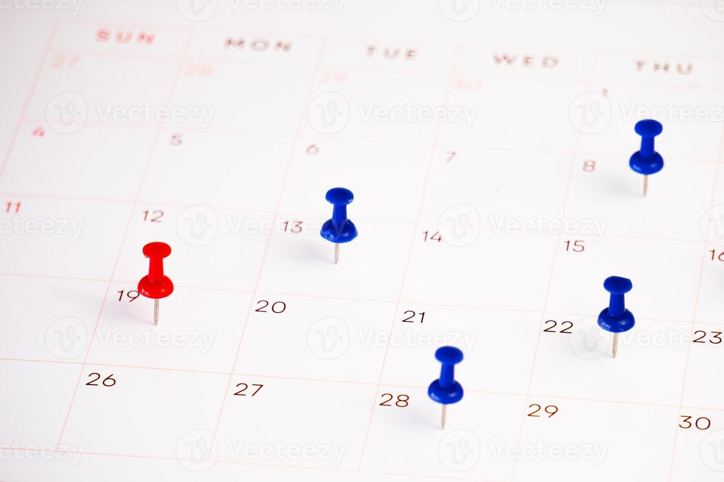date with push pin on a calendar photo