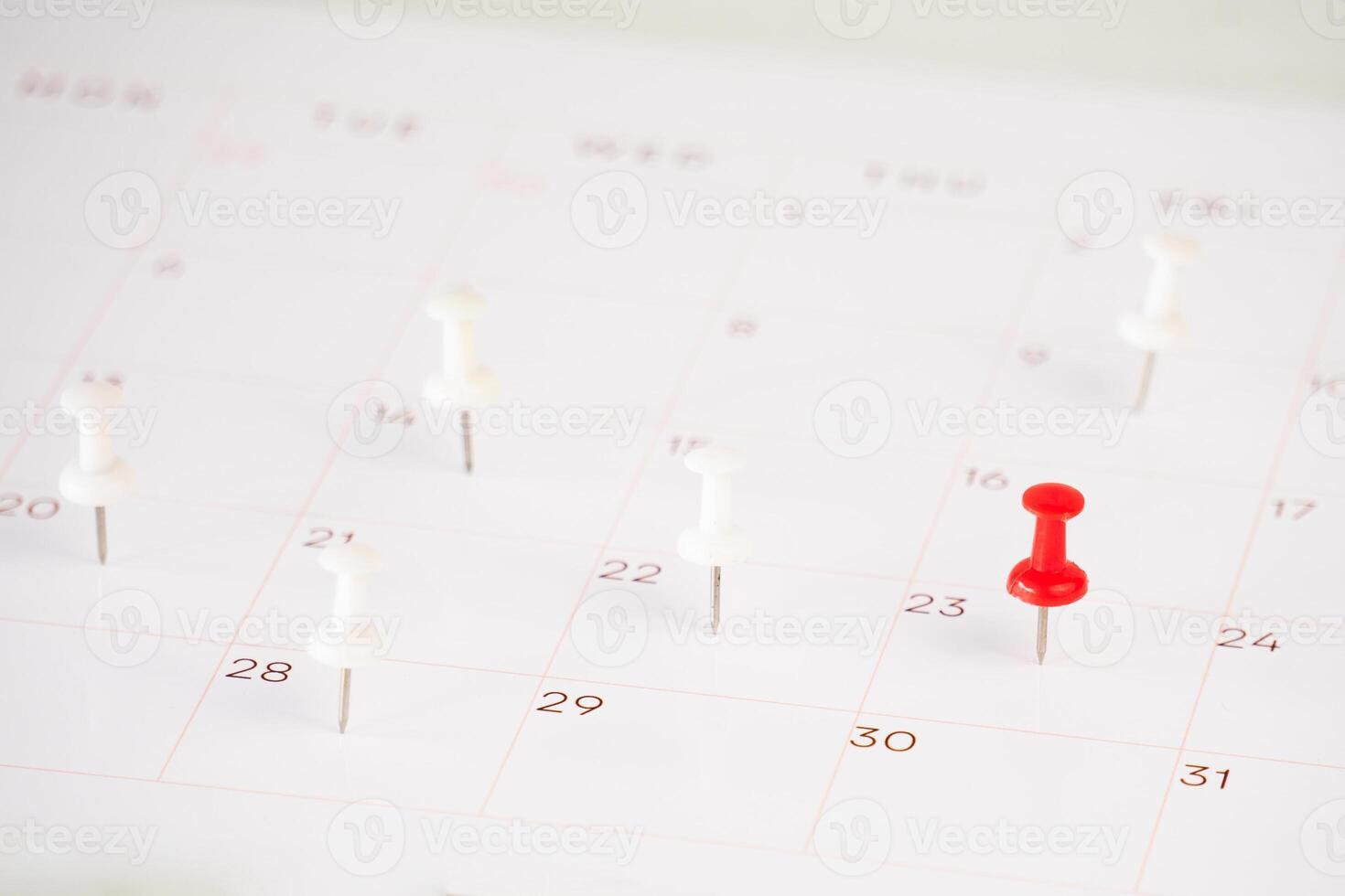 calendar and marked date with push pin photo