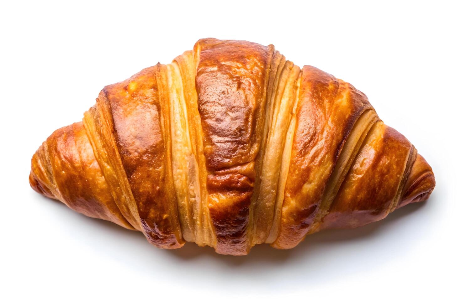 Delicious golden croissant on a white background. photo