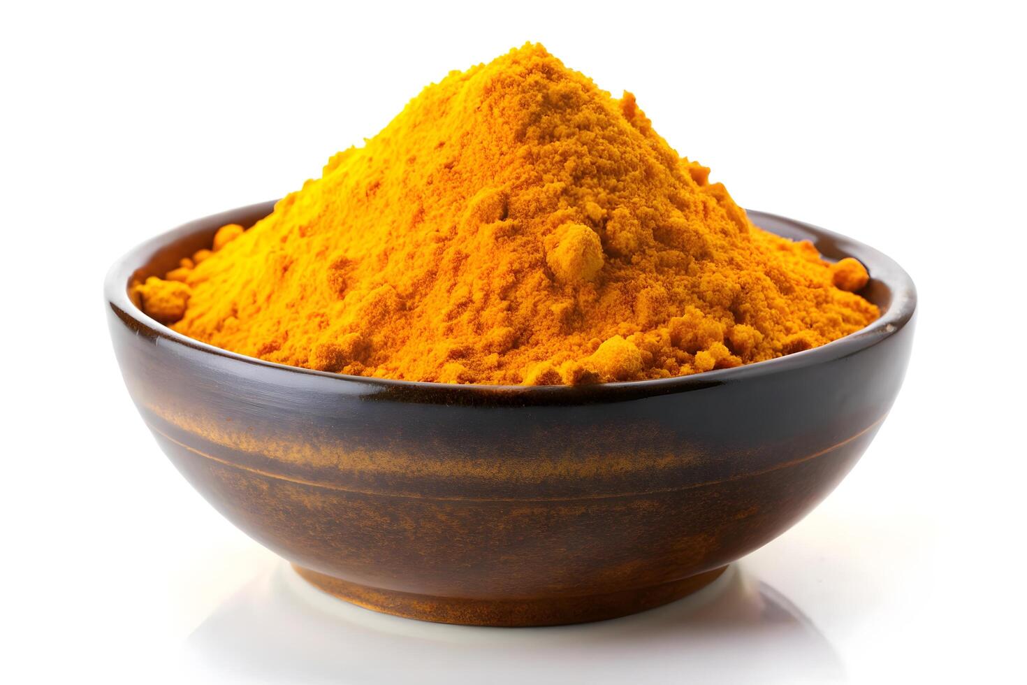Bright Turmeric Powder in a Dark Bowl photo
