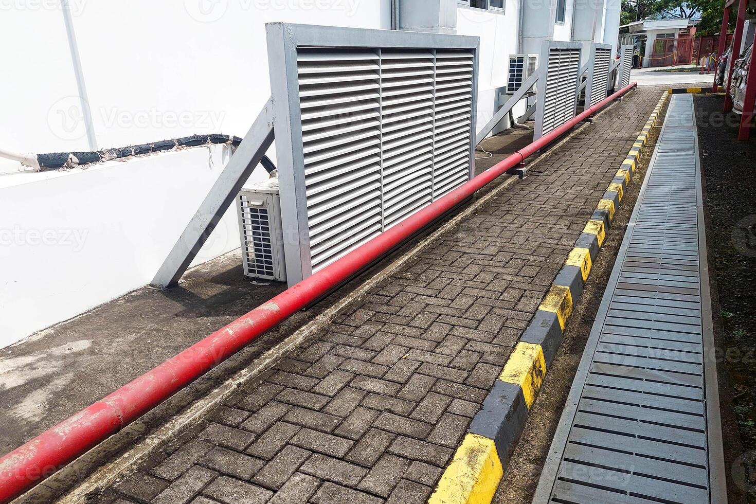 Sidewalk path beside building during the day photo