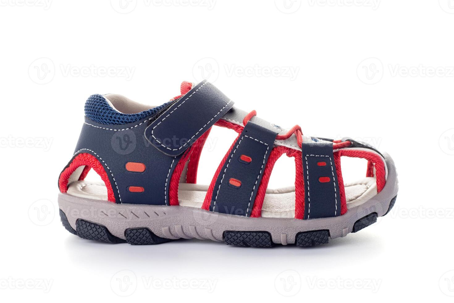 A blue childrens sandal isolated on white background. Kids leather shoes photo