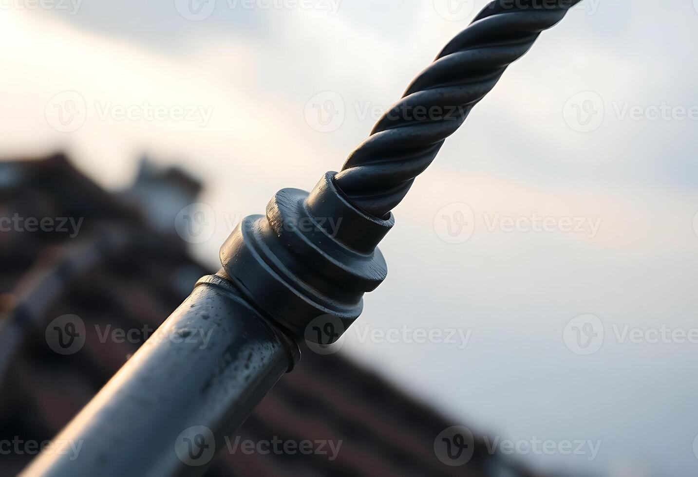 close up of a metal pole with a building in the background photo