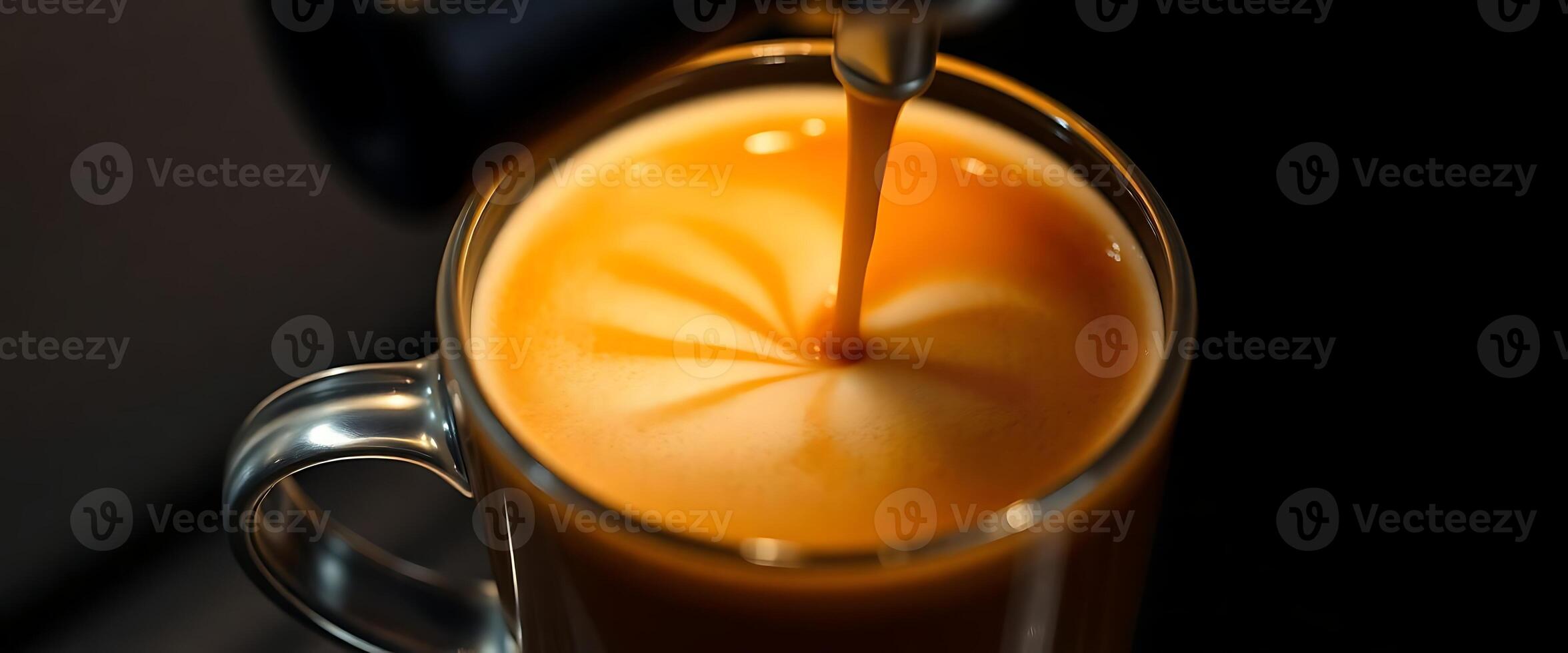 glass of orange juice with a straw sticking out of it photo