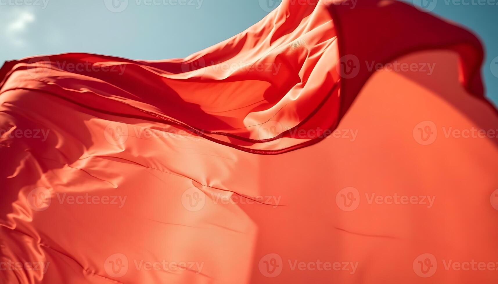 red cloth blowing in the wind on a sunny day photo