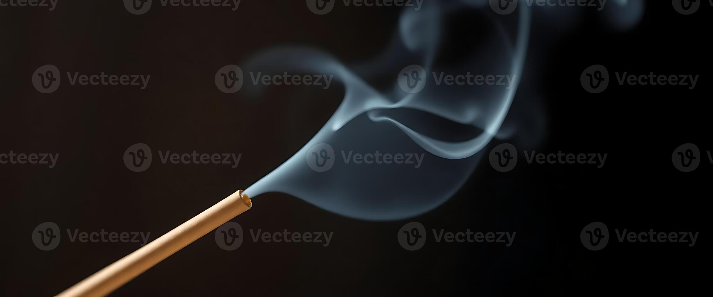 matchstick with smoke coming out of it photo