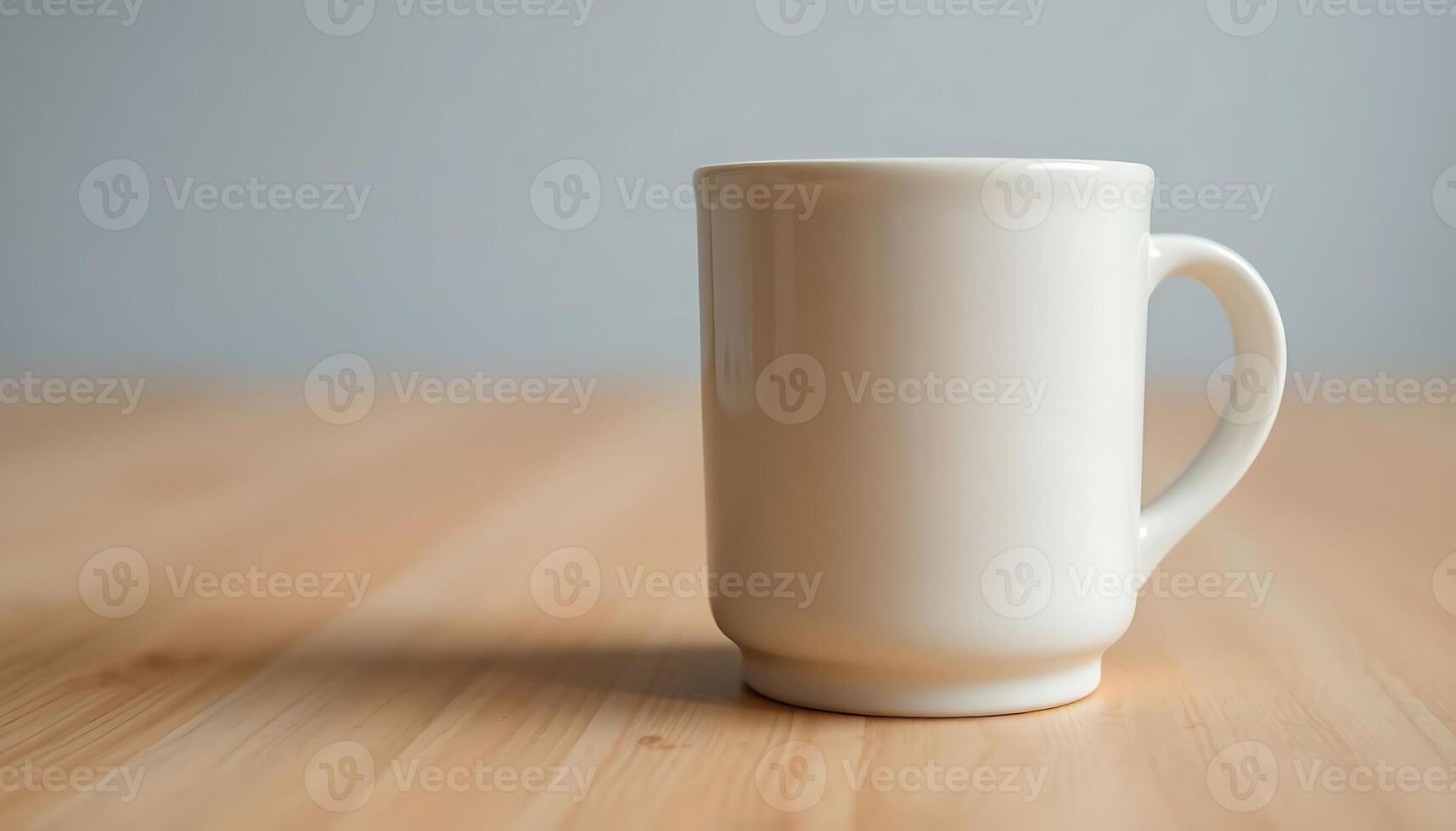 white cup sitting on top of a wooden table photo