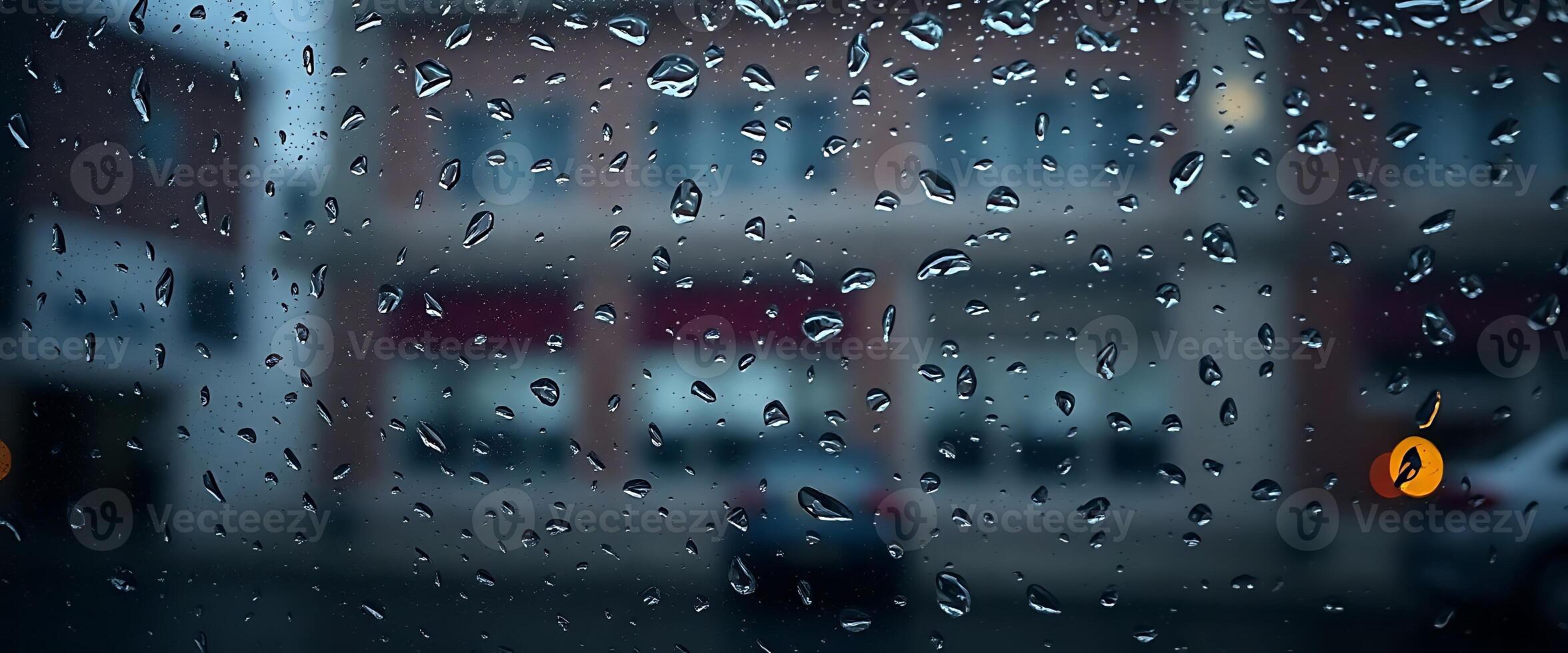 rain covered window with a building in the background photo