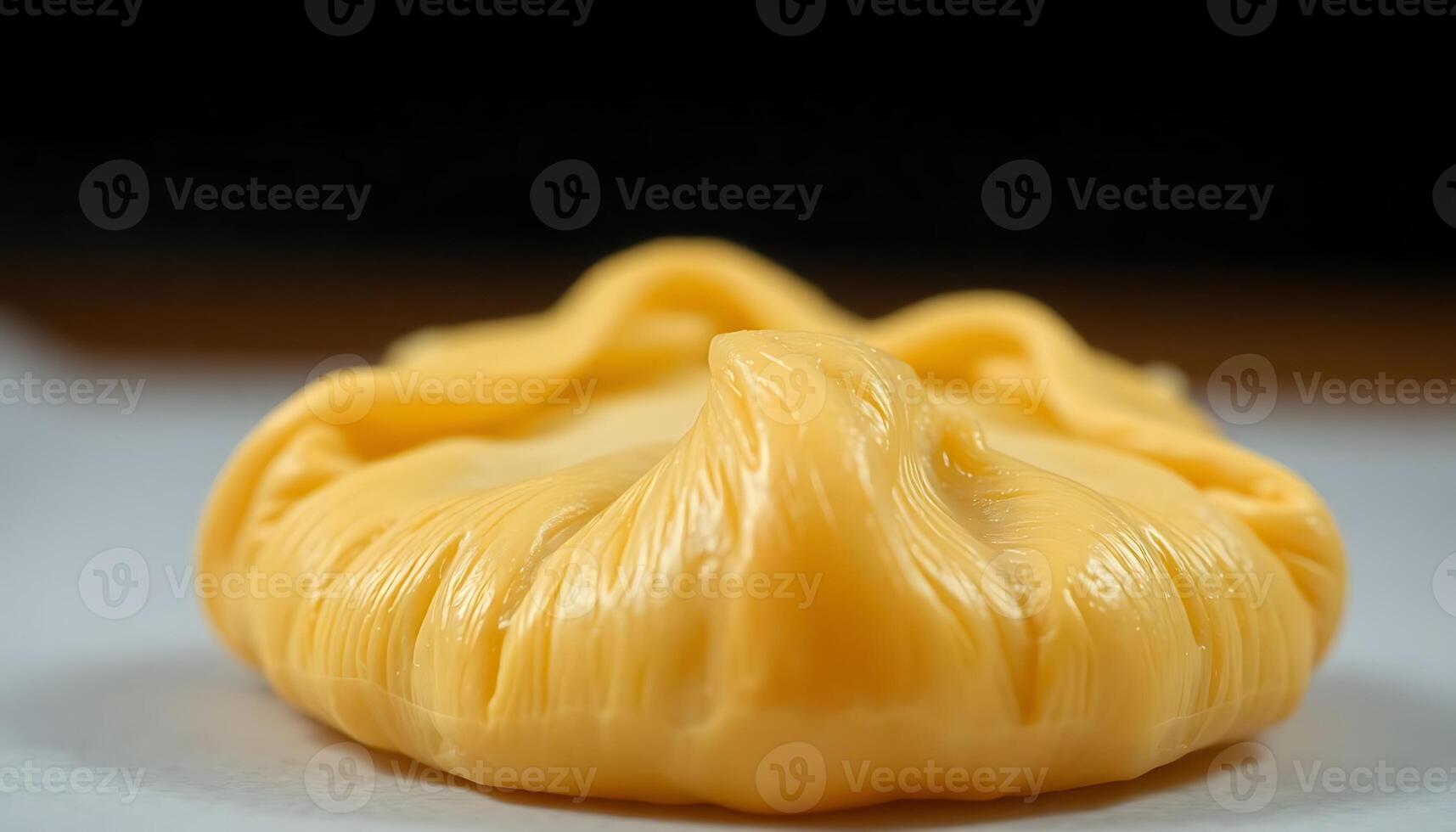 close up of a yellow pastry on a table photo