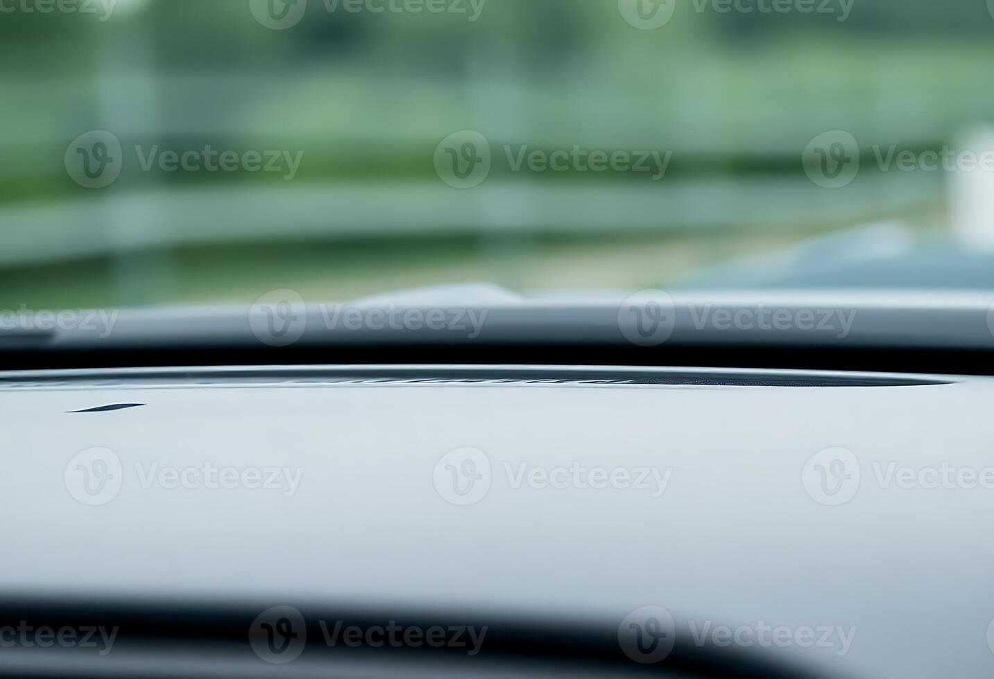 close up of a car dashboard with a blurry background photo